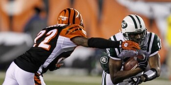 CINCINNATI - JANUARY 9:  Brad Smith #16 of the New York Jets runs the ball against Johnathan Joseph #22 of the Cincinnati Bengals during the 2010 AFC wild-card playoff game at Paul Brown Stadium on January 9, 2010 in Cincinnati, Ohio. (Photo by Jonathan D