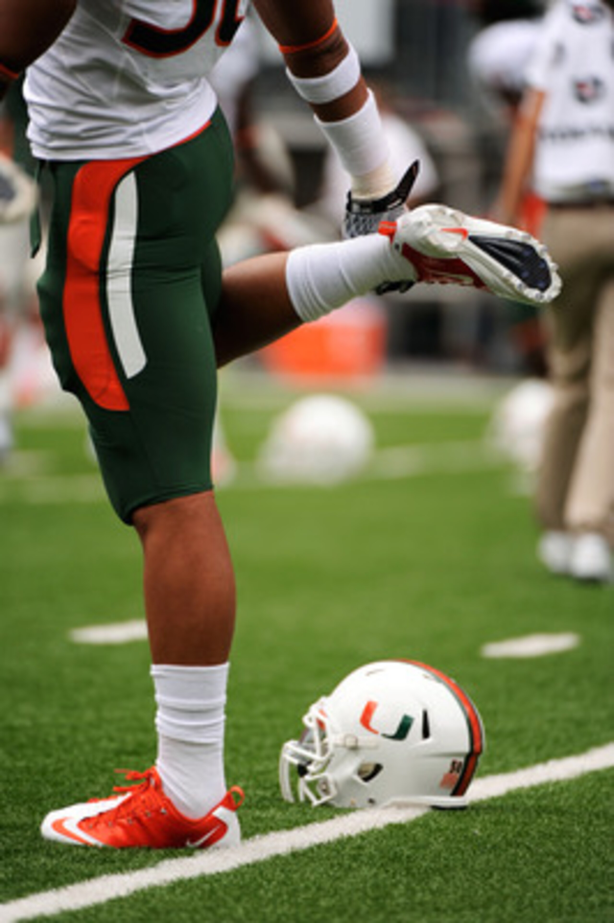 COLUMBUS, OH - SEPTEMBER 11:  A Miami Hurricanes player stretches before a game against the Ohio State Buckeyes at Ohio Stadium on September 11, 2010 in Columbus, Ohio.  (Photo by Jamie Sabau/Getty Images)