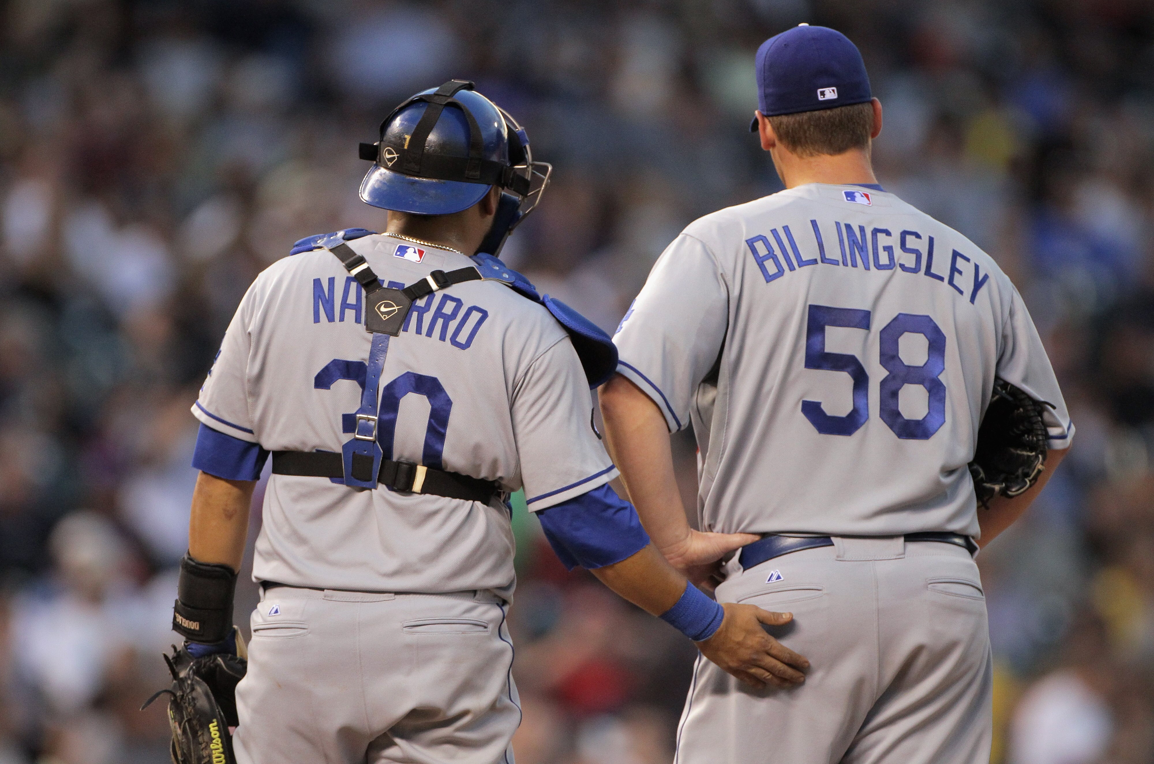 DENVER, CO - JUNE 10: Starting pitcher Chad Billingsley #58 of the Los Angeles Dodgers is sent off by catcher Dioner Navarro #30 of the Los Angeles Dodgers against the Colorado Rockies at Coors Field on June 10, 2011 in Denver, Colorado. (Photo by Doug DENVER, CO - JUNE 10: Starting pitcher Chad Billingsley #58 of the Los Angeles Dodgers is sent off by catcher Dioner Navarro #30 of the Los Angeles Dodgers against the Colorado Rockies at Coors Field on June 10, 2011 in Denver, Colorado. (Photo by Doug