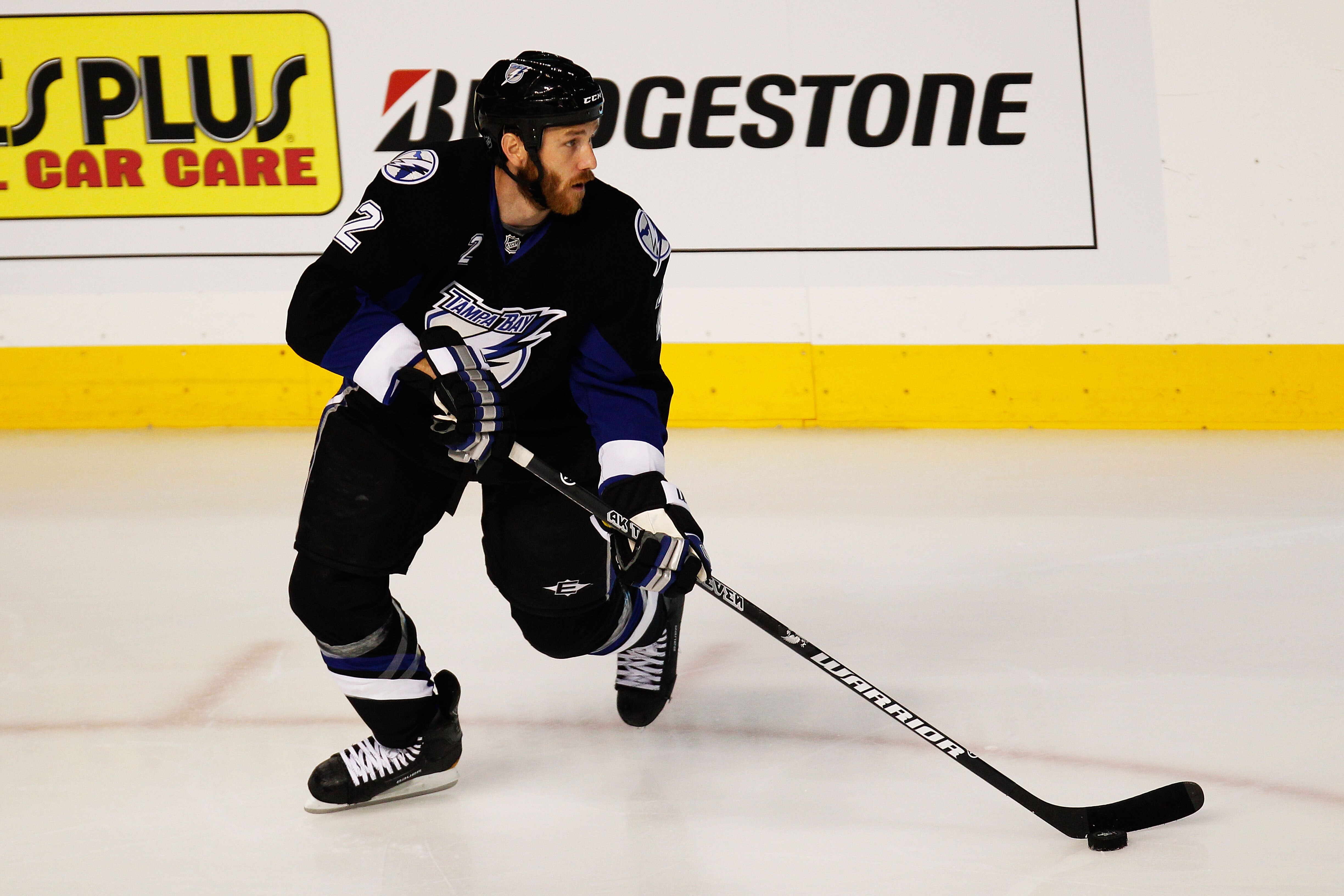 TAMPA, FL - MAY 21:  Eric Brewer #2 of the Tampa Bay Lightning controls the puck in Game Four of the Eastern Conference Finals against the Boston Bruins during the 2011 NHL Stanley Cup Playoffs at St Pete Times Forum on May 21, 2011 in Tampa, Florida.  (P