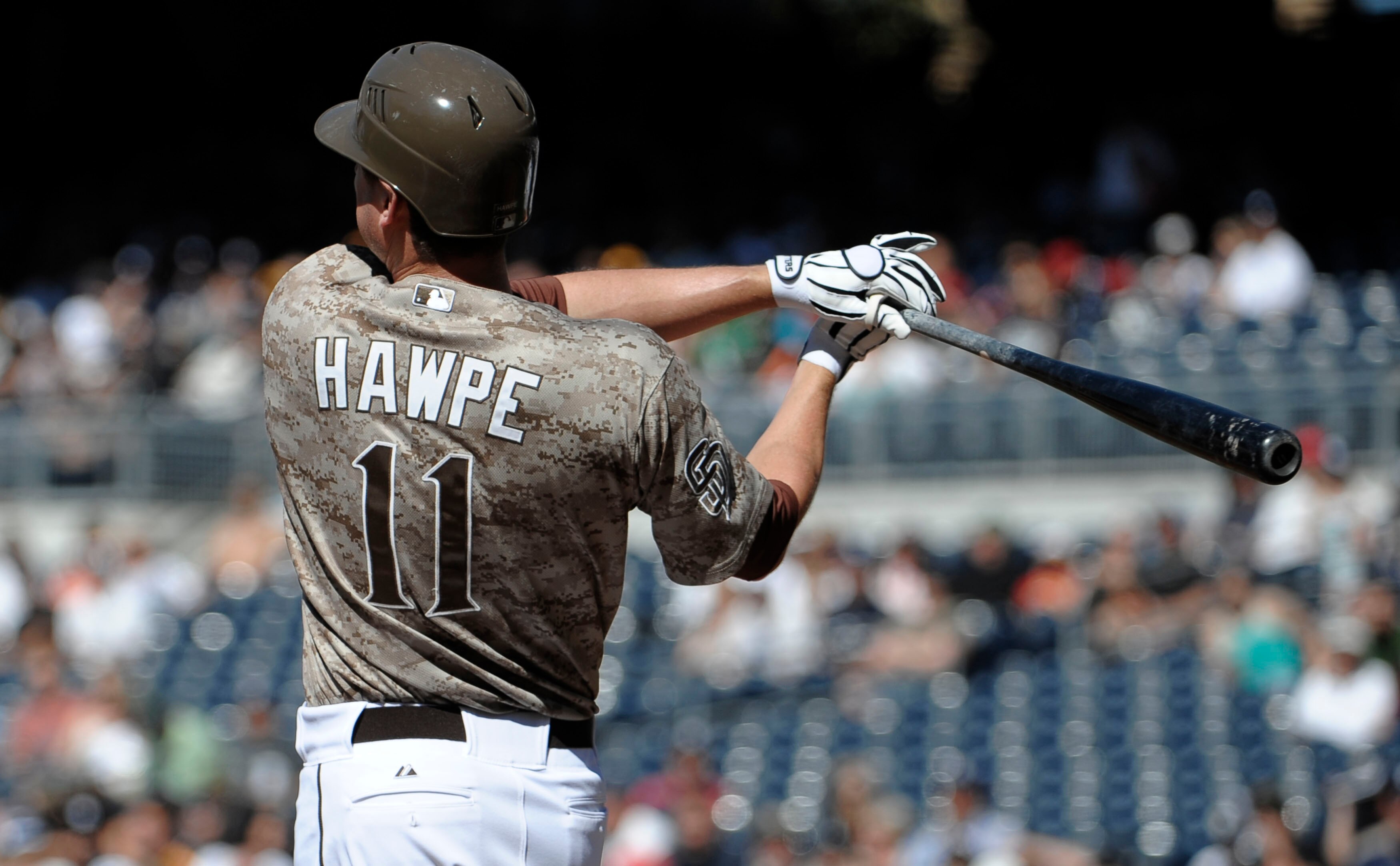 SAN DIEGO, CA - JUNE 5: Brad Hawpe #11 of the San Diego Padres hits an RBI single during the first inning of a baseball game against the Houston Astros at Petco Park on June 5, 2011 in San Diego, California. (Photo by Denis Poroy/Getty Images) SAN DIEGO, CA - JUNE 5: Brad Hawpe #11 of the San Diego Padres hits an RBI single during the first inning of a baseball game against the Houston Astros at Petco Park on June 5, 2011 in San Diego, California. (Photo by Denis Poroy/Getty Images)