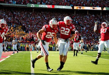 LINCOLN, NE - OCTOBER 30:  Running back Rex Burkhead #22 and  tight end Kyler Reed #25 of the Nebraska Cornhuskers celebrate a touchdown during first half action of their game at Memorial Stadium on October 30, 2010 in Lincoln, Nebraska. Nebraska Defeated