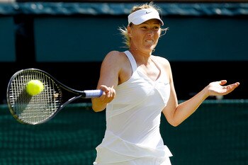 LONDON, ENGLAND - JUNE 28:  Maria Sharapova of Russia returns a shot during her match against Serena Williams of USA on Day Seven of the Wimbledon Lawn Tennis Championships at the All England Lawn Tennis and Croquet Club on June 28, 2010 in London, Englan