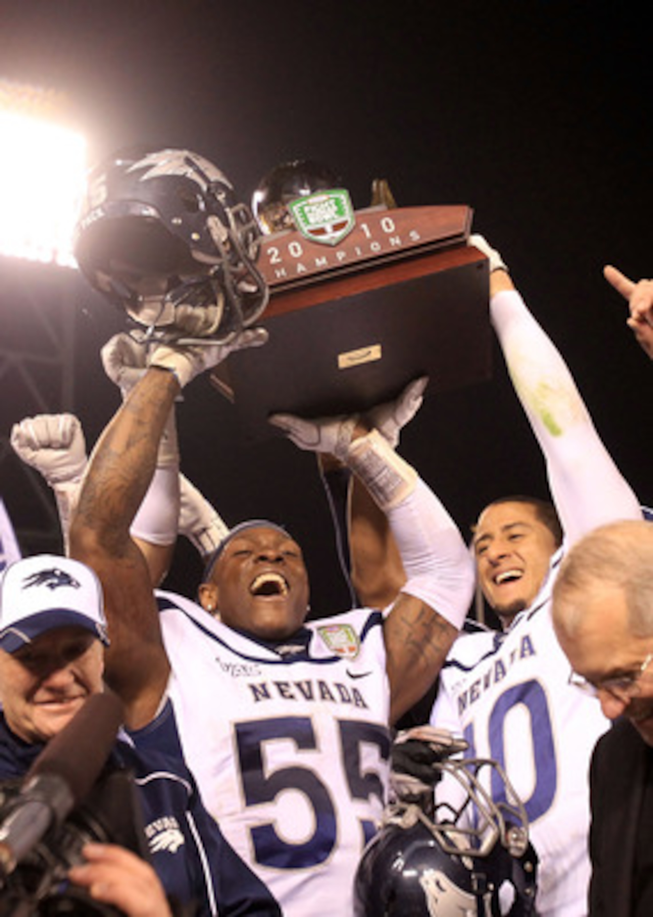 SAN FRANCISCO, CA - JANUARY 09:  Dontay Moch #55 and Colin Kaepernick #10 of the Nevada Wolf Pack hold up the trophy after they beat Boston College in the Kraft Fight Hunger Bowl at AT&T Park on January 9, 2011 in San Francisco, California.  (Photo by Ezr