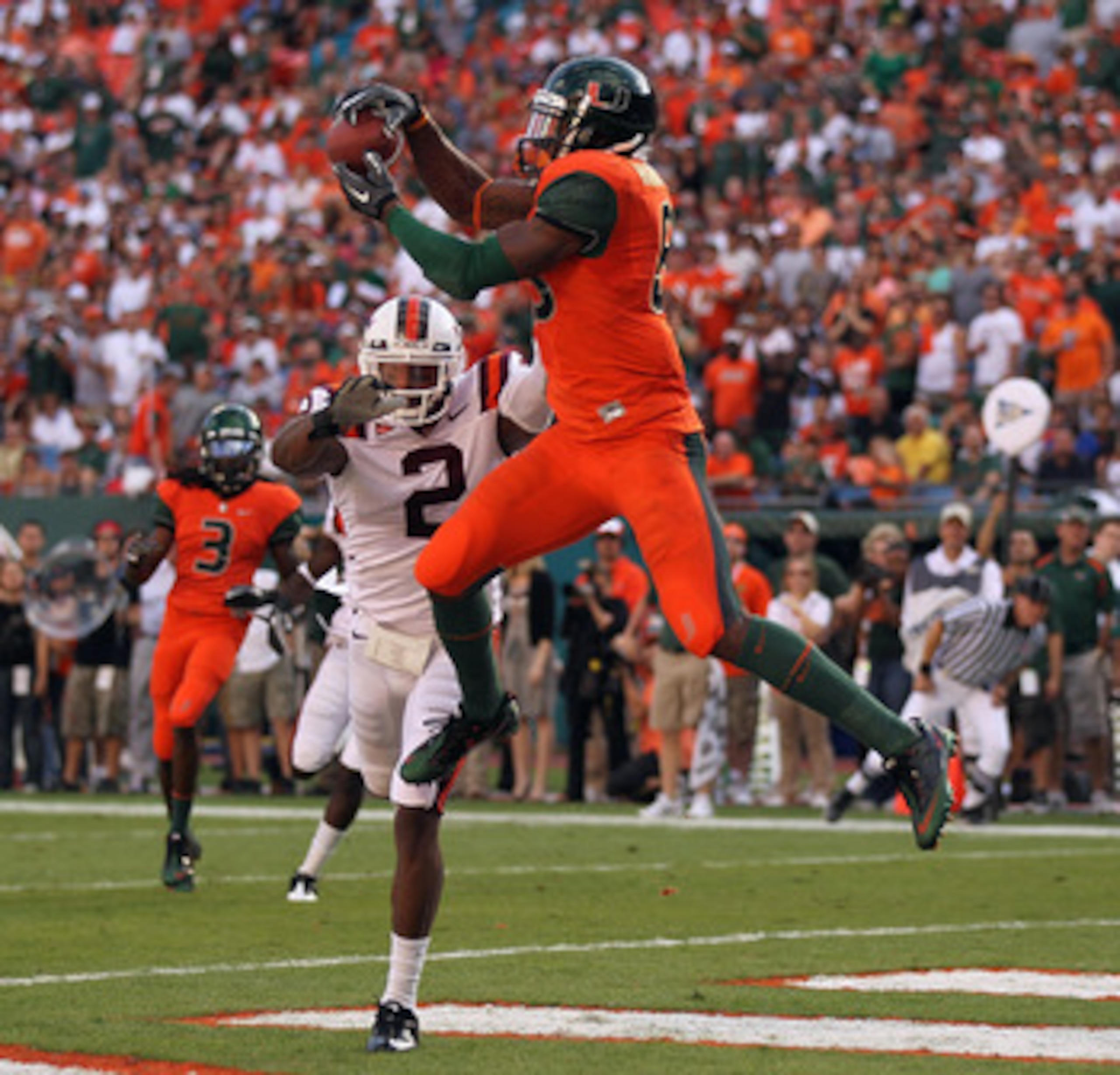MIAMI - NOVEMBER 20: Leonard Hankerson #85 of the Miami Hurricanes catches a touchdown over Davon Morgan #2 of the Virginia Tech Hokies at Sun Life Stadium on November 20, 2010 in Miami, Florida.  (Photo by Mike Ehrmann/Getty Images)