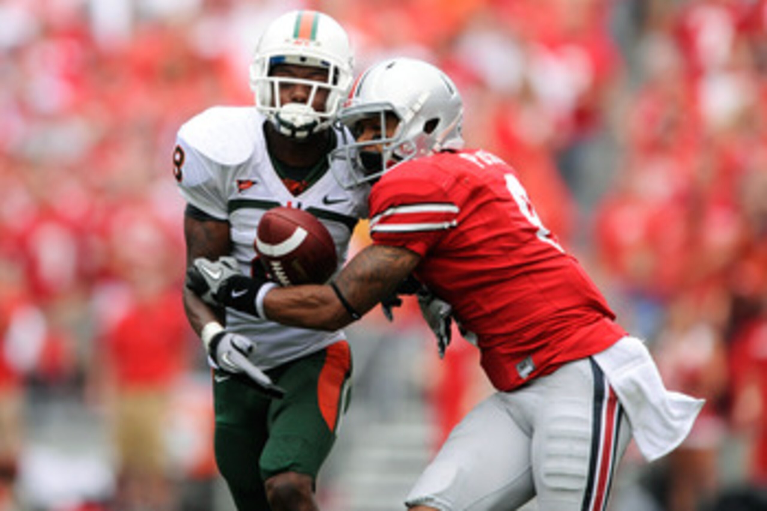 COLUMBUS, OH - SEPTEMBER 11:  DeVier Posey #8 of the Ohio State Buckeyes battles with DeMarcus Van Dyke #8 for possession of a pass at Ohio Stadium on September 11, 2010 in Columbus, Ohio.  The pass was incomplete.  (Photo by Jamie Sabau/Getty Images)