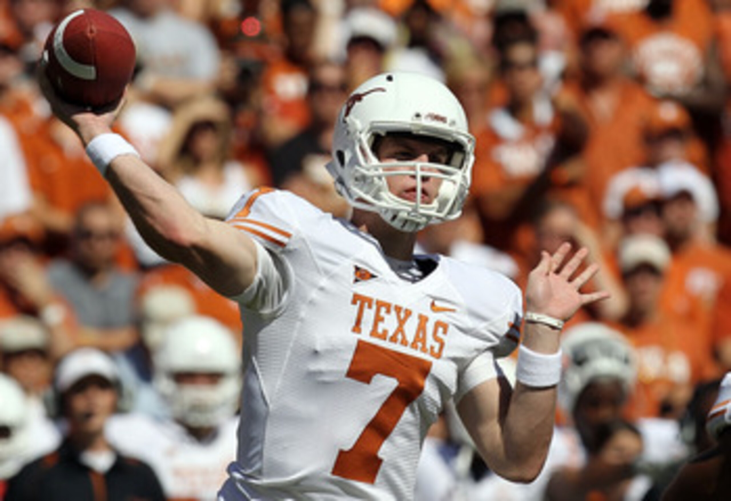 DALLAS - OCTOBER 02: Quarterback Garrett Gilbert #7 of the Texas Longhorns drops back to pass against the Oklahoma Sooners in the second quarter at the Cotton Bowl on October 2, 2010 in Dallas, Texas. (Photo by Ronald Martinez/Getty Images) DALLAS - OCTOBER 02: Quarterback Garrett Gilbert #7 of the Texas Longhorns drops back to pass against the Oklahoma Sooners in the second quarter at the Cotton Bowl on October 2, 2010 in Dallas, Texas. (Photo by Ronald Martinez/Getty Images)