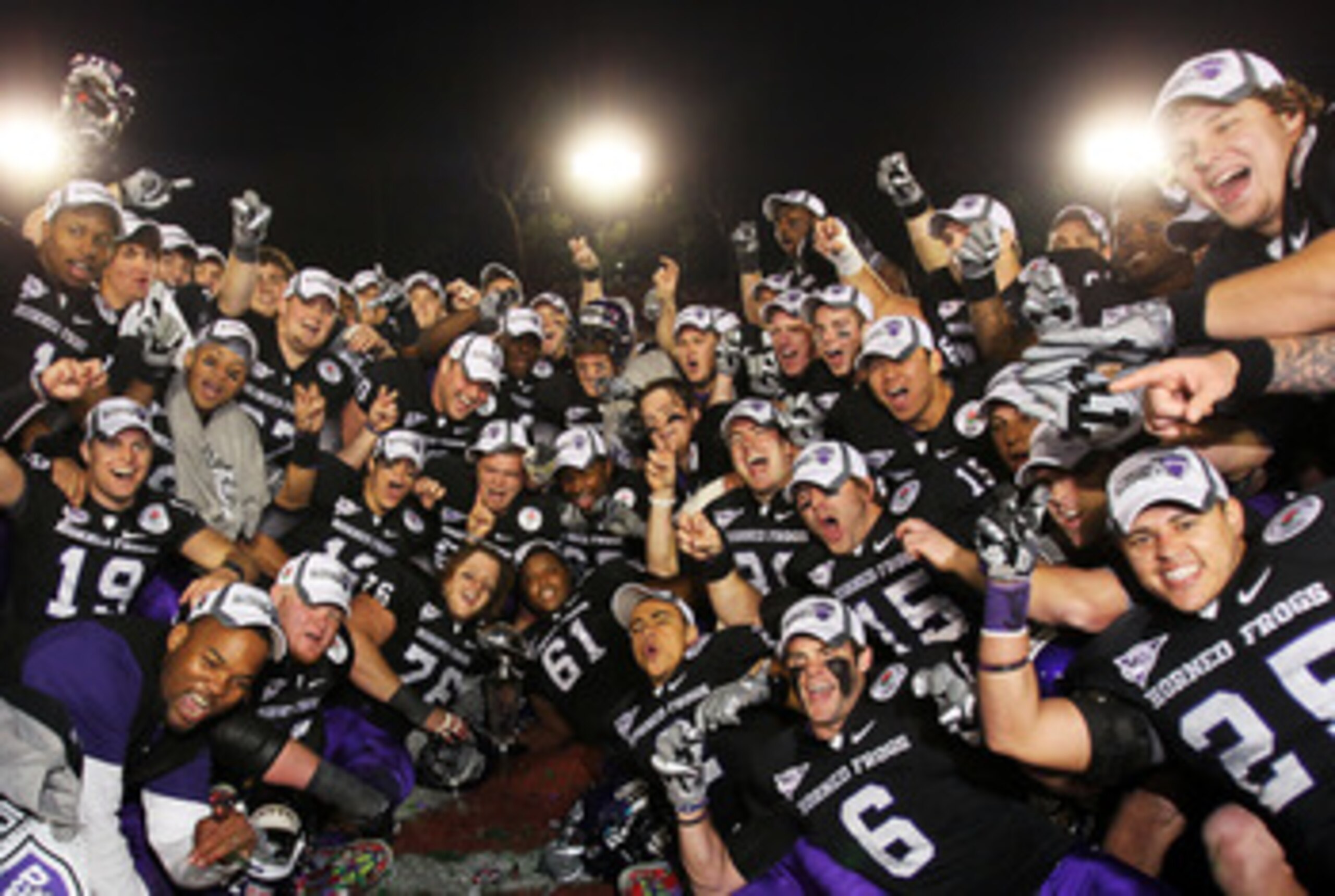 PASADENA, CA - JANUARY 01: The TCU Horned Frogs celebrate with the Rose Bowl Championship Trophy after defeating the Wisconsin Badgers 21-19 in the 97th Rose Bowl game on January 1, 2011 in Pasadena, California. (Photo by Jeff Gross/Getty Images) PASADENA, CA - JANUARY 01: The TCU Horned Frogs celebrate with the Rose Bowl Championship Trophy after defeating the Wisconsin Badgers 21-19 in the 97th Rose Bowl game on January 1, 2011 in Pasadena, California. (Photo by Jeff Gross/Getty Images)
