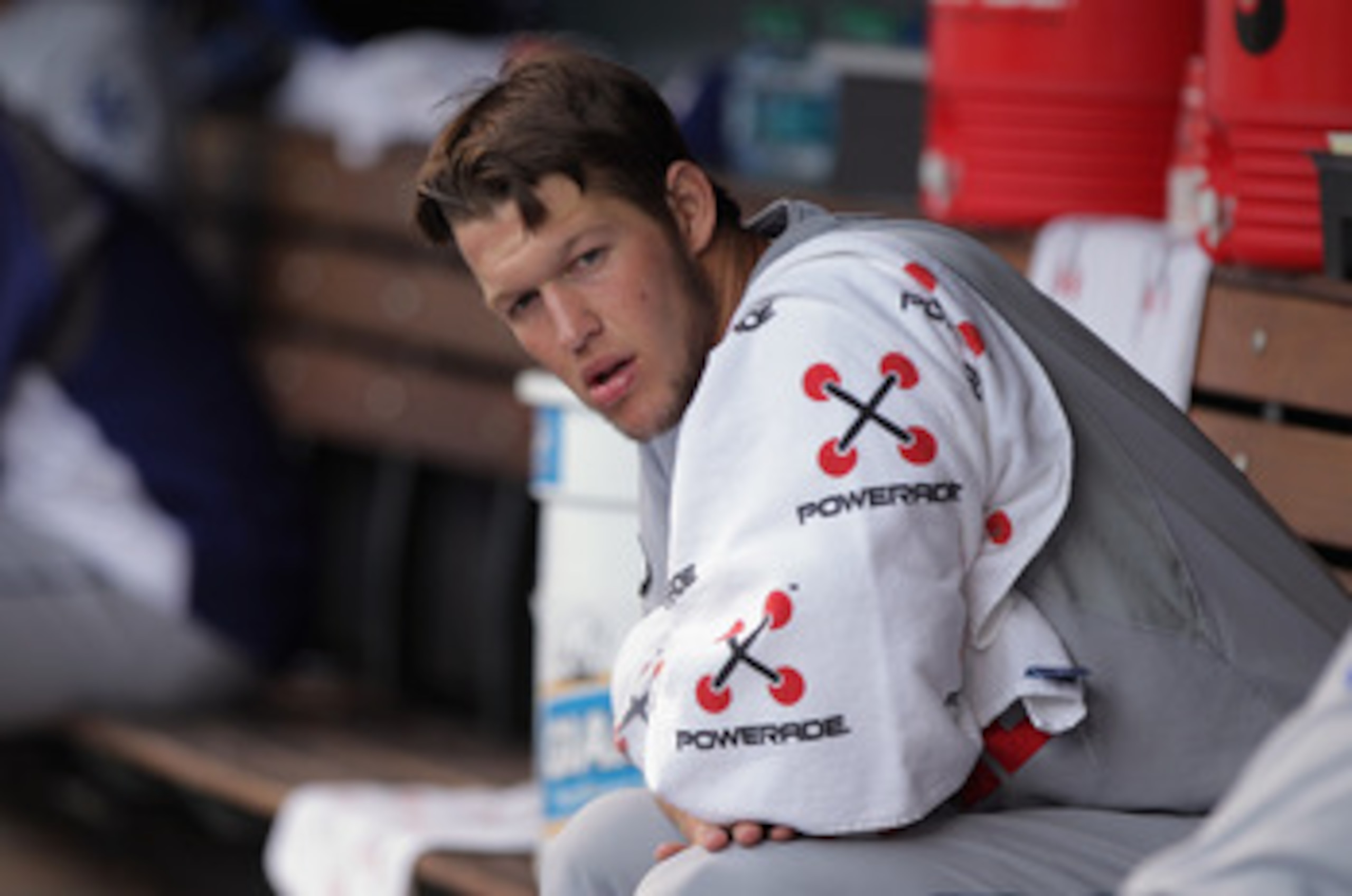 DENVER, CO - JUNE 09: Starting pitcher Clayton Kershaw #22 of the Los Angeles Dodgers looks on from the dugout prior to facing the Colorado Rockies at Coors Field on June 9, 2011 in Denver, Colorado. (Photo by Doug Pensinger/Getty Images) DENVER, CO - JUNE 09: Starting pitcher Clayton Kershaw #22 of the Los Angeles Dodgers looks on from the dugout prior to facing the Colorado Rockies at Coors Field on June 9, 2011 in Denver, Colorado. (Photo by Doug Pensinger/Getty Images)