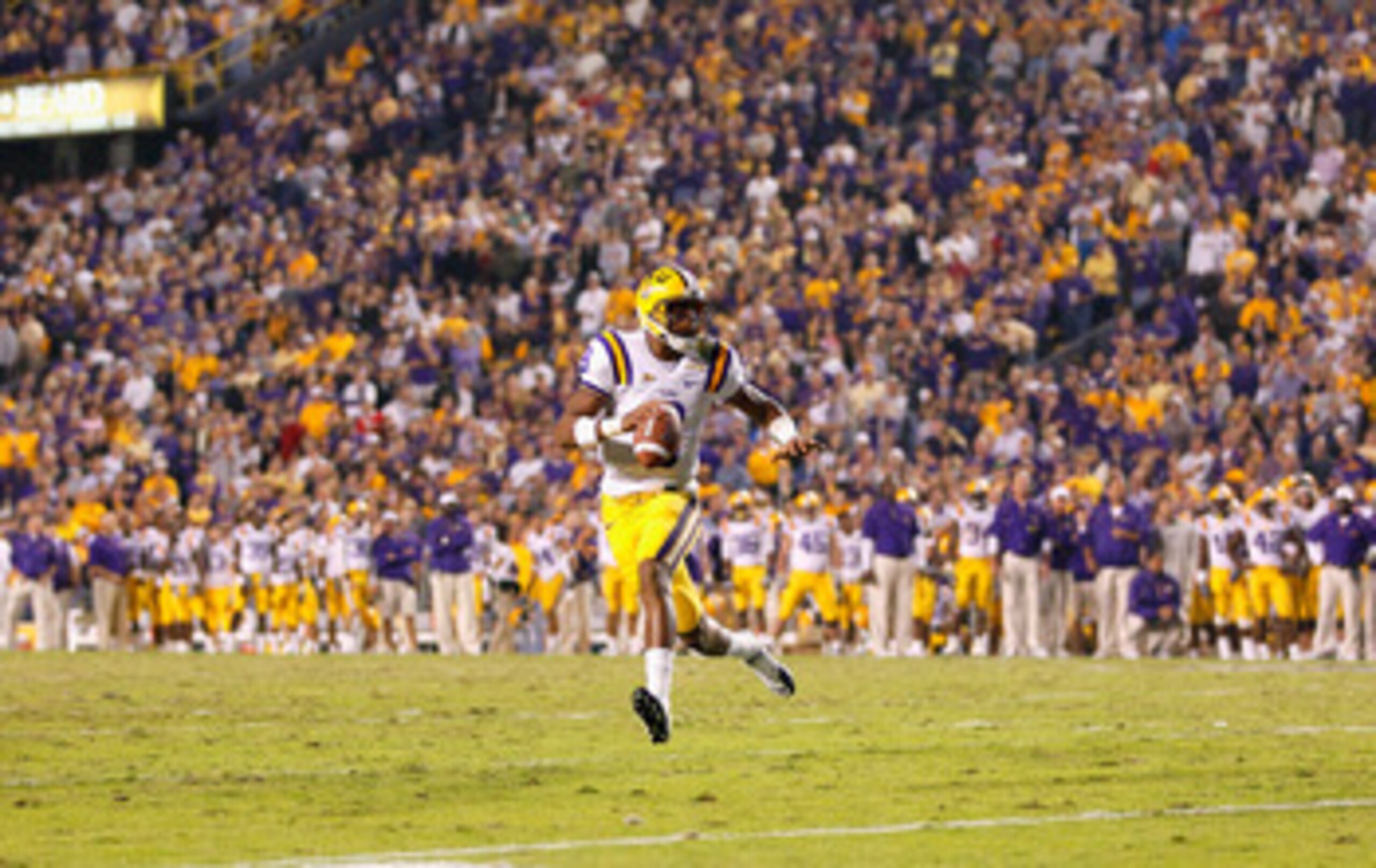 BATON ROUGE, LA - NOVEMBER 20: Quarterback Jordan Jefferson #9 of the Louisiana State University Tigers rushes out of the pocket against the Ole Miss Rebels at Tiger Stadium on November 20, 2010 in Baton Rouge, Louisiana. (Photo by Kevin C. Cox/Getty Im BATON ROUGE, LA - NOVEMBER 20: Quarterback Jordan Jefferson #9 of the Louisiana State University Tigers rushes out of the pocket against the Ole Miss Rebels at Tiger Stadium on November 20, 2010 in Baton Rouge, Louisiana. (Photo by Kevin C. Cox/Getty Im