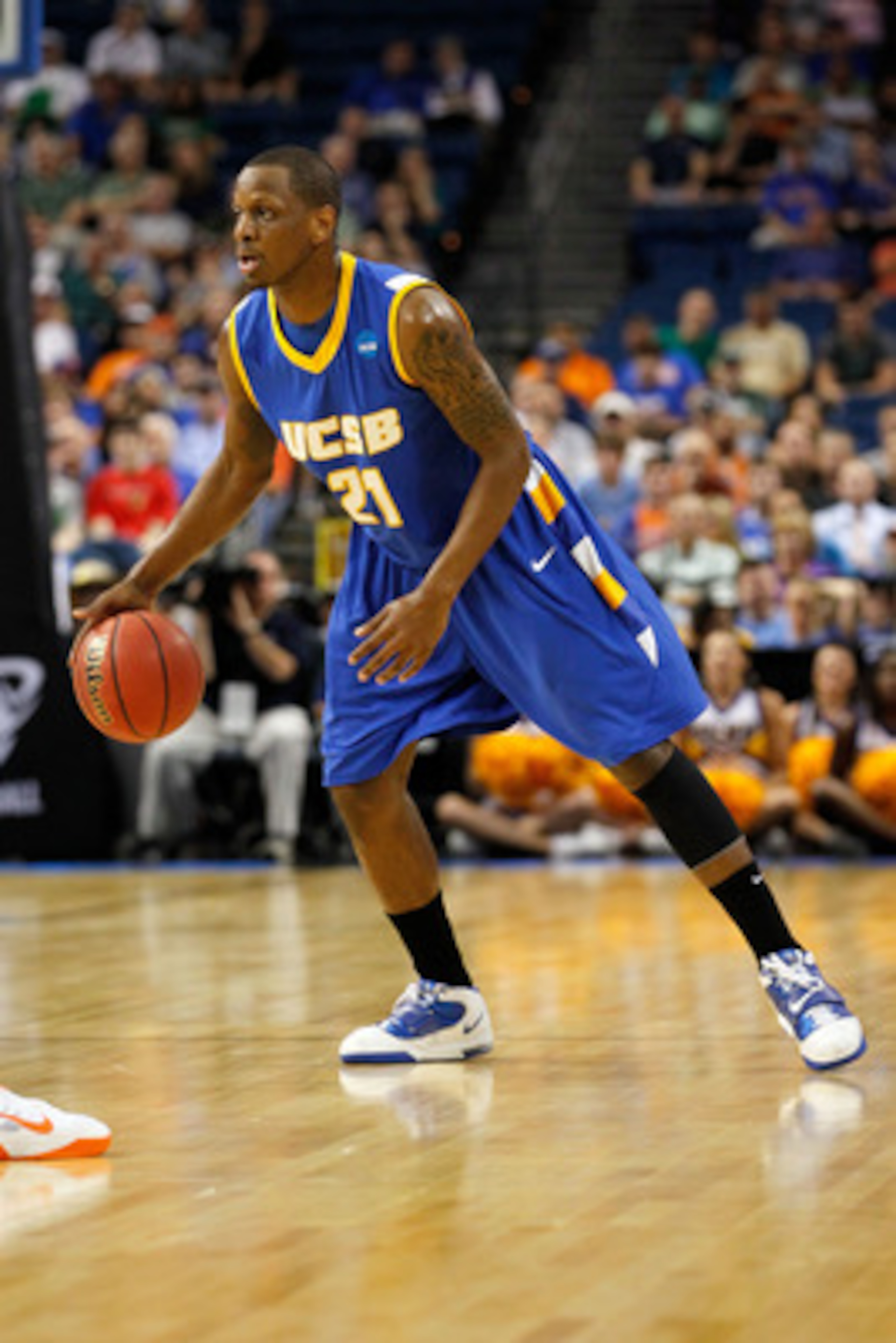 TAMPA, FL - MARCH 17: James Nunnally #21 of the UC Santa Barbara Gauchos looks to pass the ball against the Florida Gators during the second round of the 2011 NCAA men's basketball tournament at St. Pete Times Forum on March 17, 2011 in Tampa, Florida. F TAMPA, FL - MARCH 17: James Nunnally #21 of the UC Santa Barbara Gauchos looks to pass the ball against the Florida Gators during the second round of the 2011 NCAA men's basketball tournament at St. Pete Times Forum on March 17, 2011 in Tampa, Florida. F