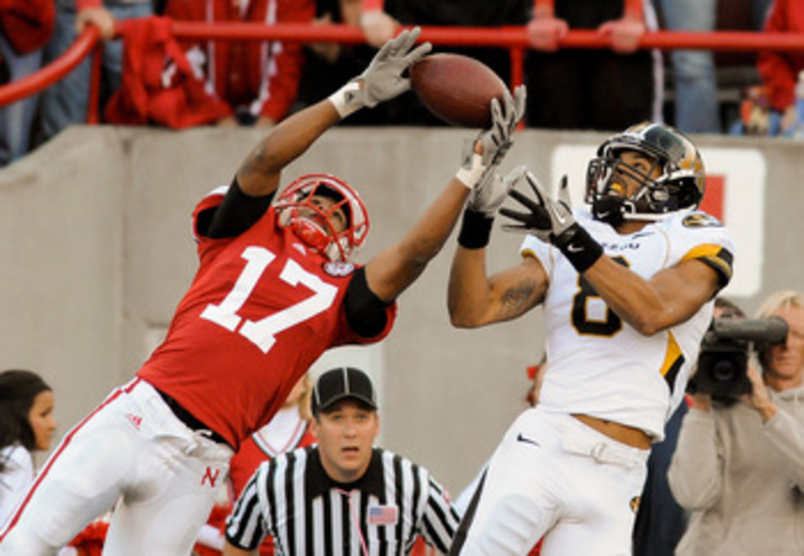 LINCOLN, NE - OCTOBER 30: Defensive back Ciante Evans #17 of the Nebraska Cornhuskers breaks up a intended for wide receiver Wes Kemp #8 of the Missouri Tigers during second half action of their game at Memorial Stadium on October 30, 2010 in Lincoln, Neb