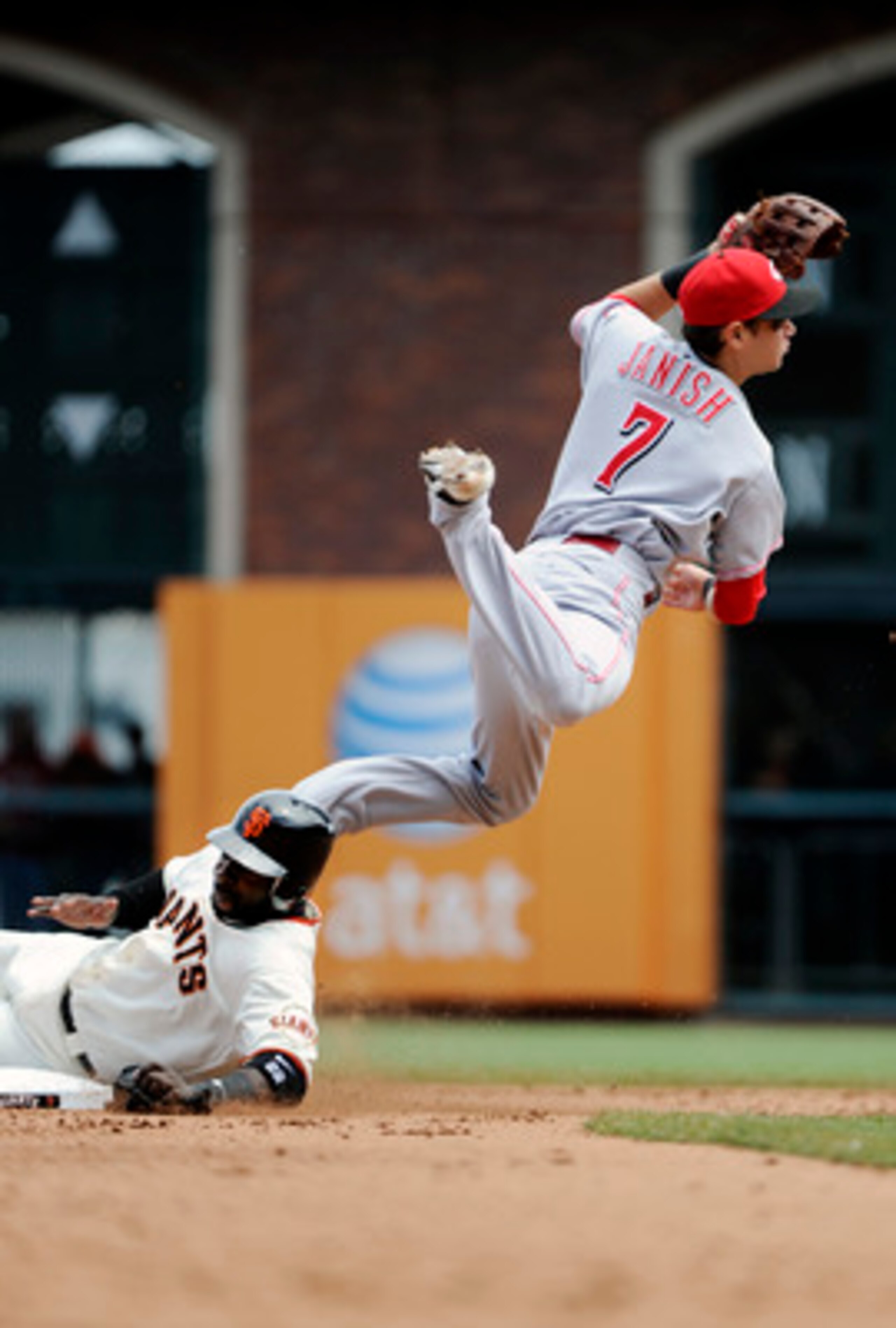 SAN FRANCISCO, CA - JUNE 11: Bill Hall #29 of the San Francisco Giants breaks up the double play sliding in hard to Paul Janish #7 of the Cincinnati Reds in the fifth inning during a MLB baseball game June 11, 2011 at AT&T Park in San Francisco, Californi SAN FRANCISCO, CA - JUNE 11: Bill Hall #29 of the San Francisco Giants breaks up the double play sliding in hard to Paul Janish #7 of the Cincinnati Reds in the fifth inning during a MLB baseball game June 11, 2011 at AT&T Park in San Francisco, Californi