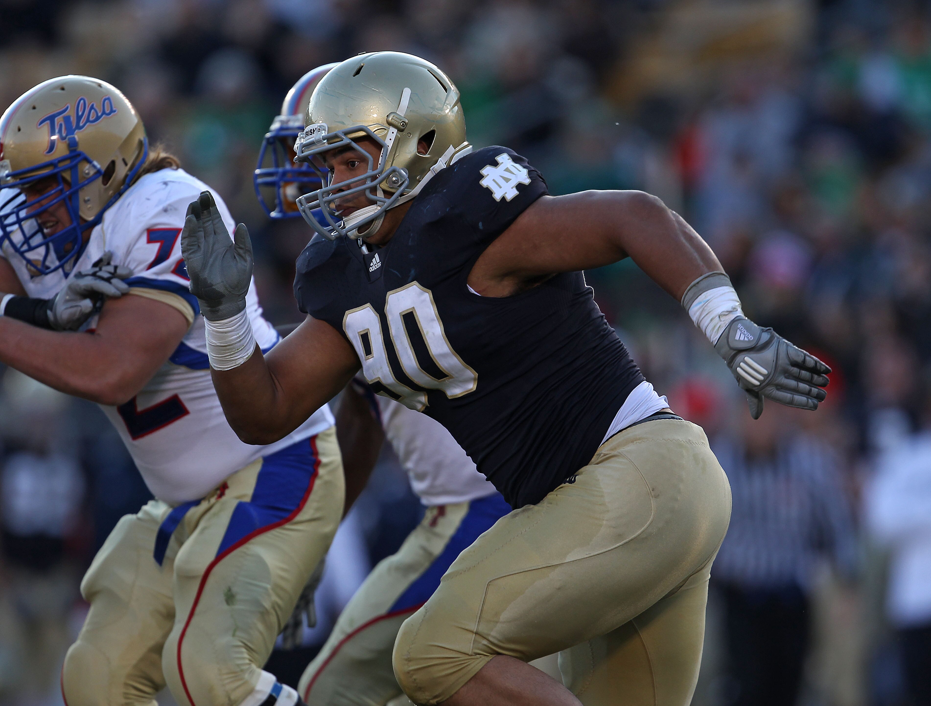 SOUTH BEND, IN - OCTOBER 30: Ethan Johnson #90 of the Notre Dame Fighting Irish pursues a runner against the Tulsa Golden Hurricane at Notre Dame Stadium on October 30, 2010 in South Bend, Indiana. Tulsa defeated Notre Dame 28-27. (Photo by Jonathan Danie