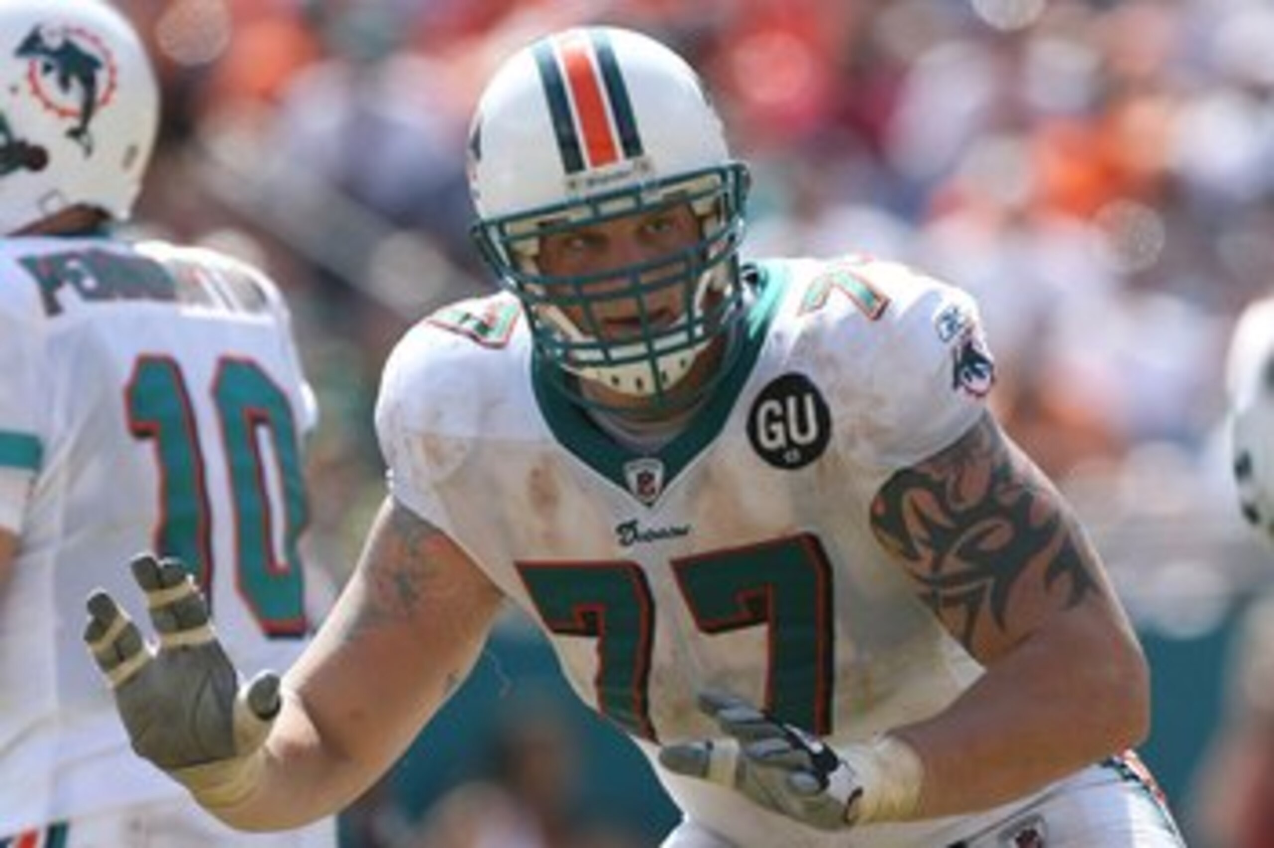 MIAMI - SEPTEMBER 07:  Offensive tackle Jake Long #77 of the Miami Dolphins pass blocks against the New York Jets at Dolphin Stadium on September 7, 2008 in Miami, Florida. The Jets won 20-14.  (Photo by Doug Benc/Getty Images)