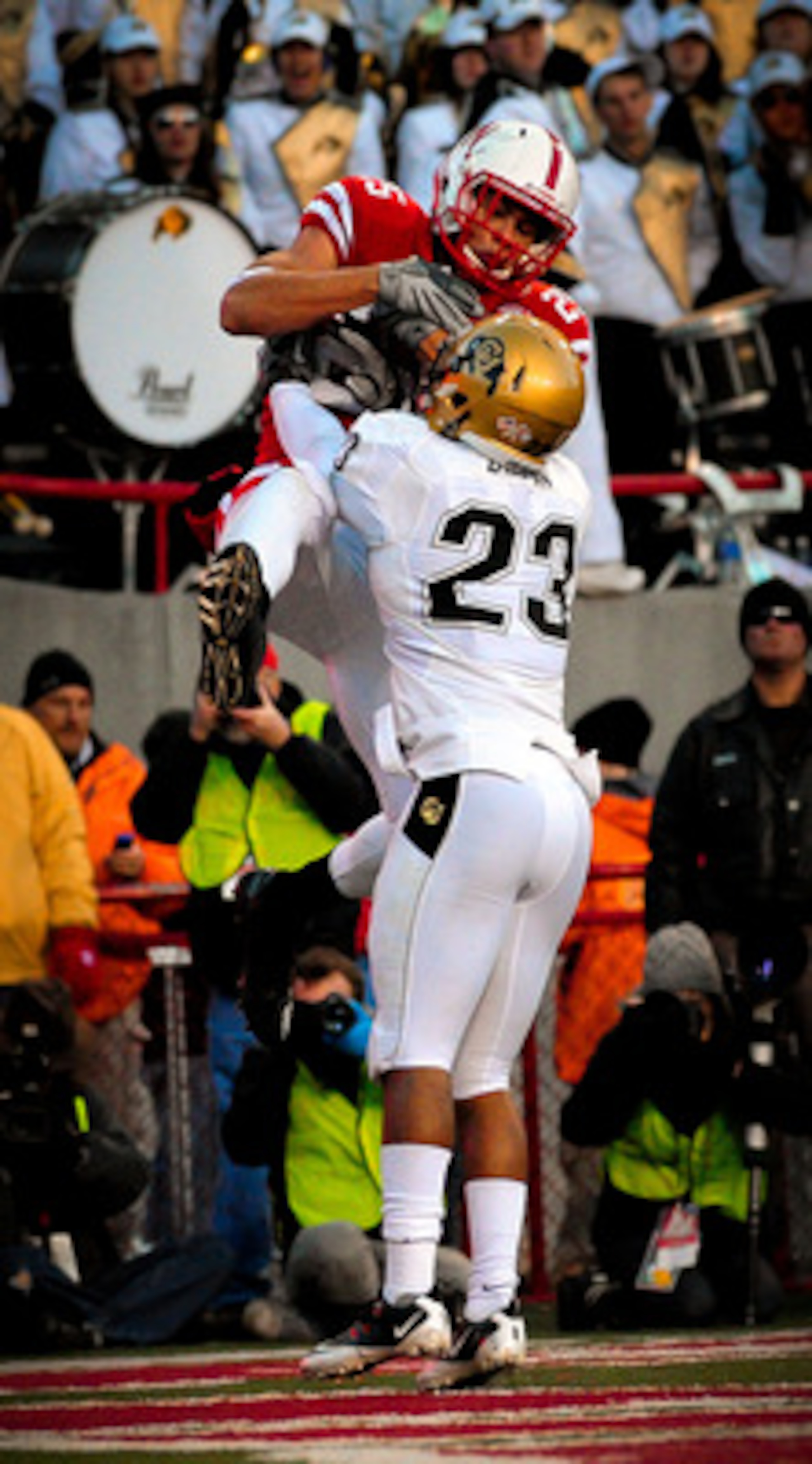 LINCOLN, NE - NOVEMBER 26: Kyler Reed #25 of the Nebraska Cornhuskers catches a touchdown over Jalil Brown #23 of the Colorado Buffaloes during the second half of their game at Memorial Stadium on November 26, 2010 in Lincoln, Nebraska. Nebraska defeated 