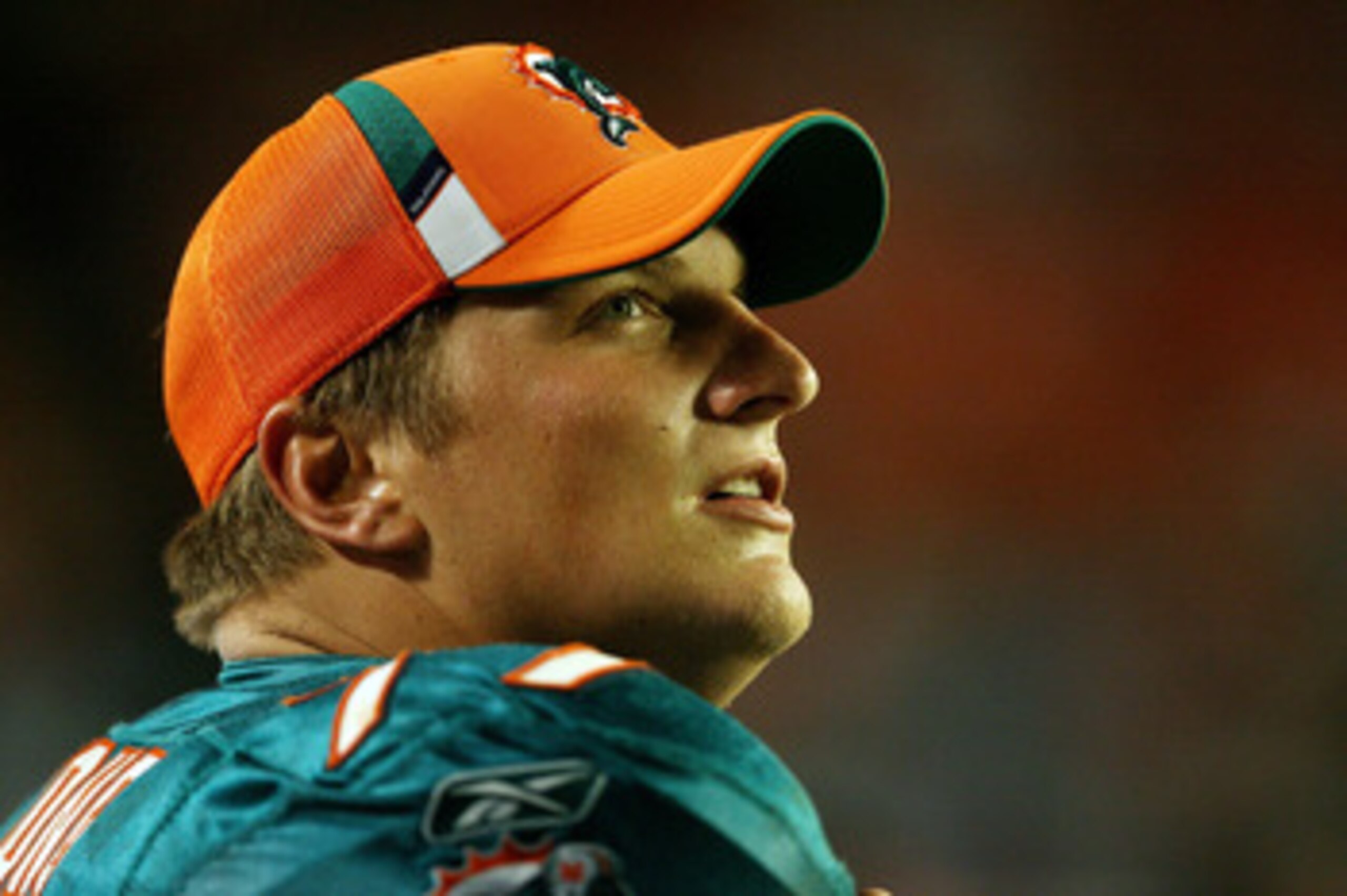 MIAMI - AUGUST 22:  Offensive tackle Jake Long #77 of the Miami Dolphins watches from the sidelines as his team takes on the Carolina Panthers during a pre-season game at Land Shark Stadium on August 22, 2009 in Miami, Florida. The Dolphins defeated the P