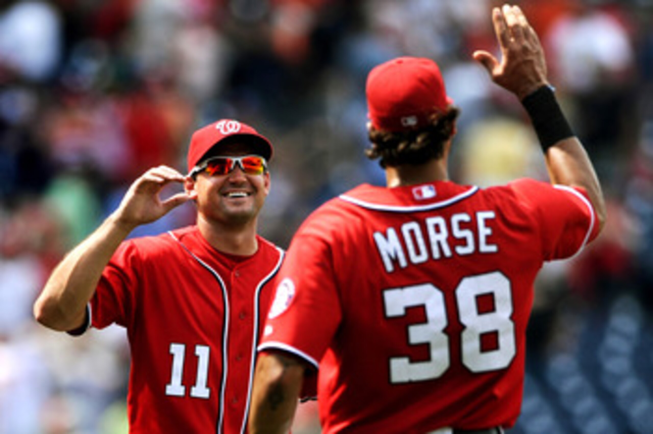 WASHINGTON, DC - JUNE 18: Ryan Zimmerman #11 and Jayson Werth of the Washington Nationals celebrate after defeating the Baltimore Orioles, 4-2, at Nationals Park on June 18, 2011 in Washington, DC. The Washington Nationals won, 4-2. (Photo by Patrick Smit