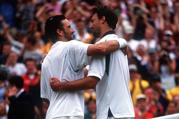 9 Jul 2001:  Goran Ivanisevic of Croatia is hugged by Pat Rafter of Australia after winning in the Men's Final's of The All England Lawn Tennis Championship at Wimbledon, London. Mandatory Credit: Gary M. Prior/ALLSPORT