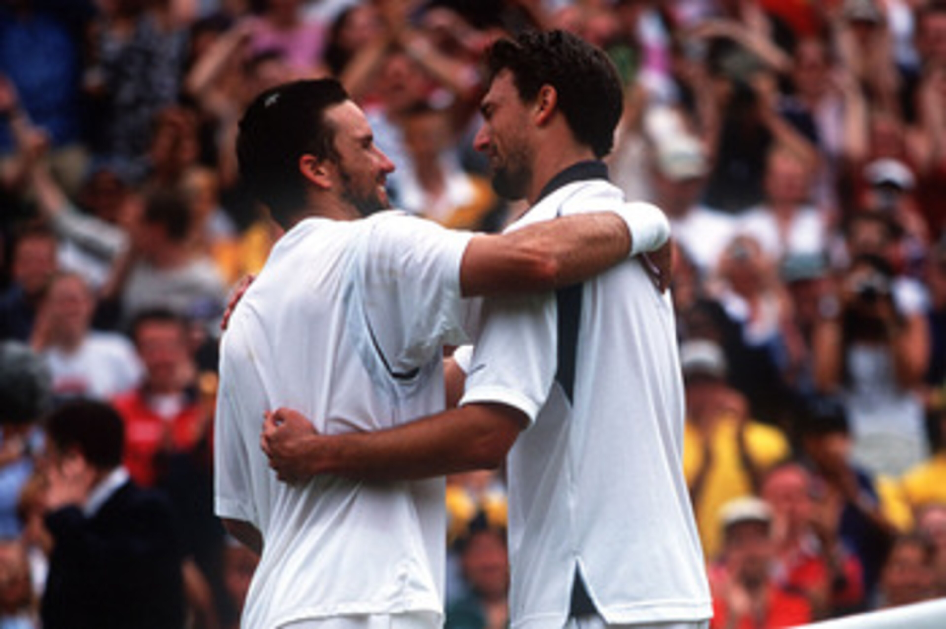 9 Jul 2001: Goran Ivanisevic of Croatia is hugged by Pat Rafter of Australia after winning in the Men's Final's of The All England Lawn Tennis Championship at Wimbledon, London. Mandatory Credit: Gary M. Prior/ALLSPORT 9 Jul 2001: Goran Ivanisevic of Croatia is hugged by Pat Rafter of Australia after winning in the Men's Final's of The All England Lawn Tennis Championship at Wimbledon, London. Mandatory Credit: Gary M. Prior/ALLSPORT
