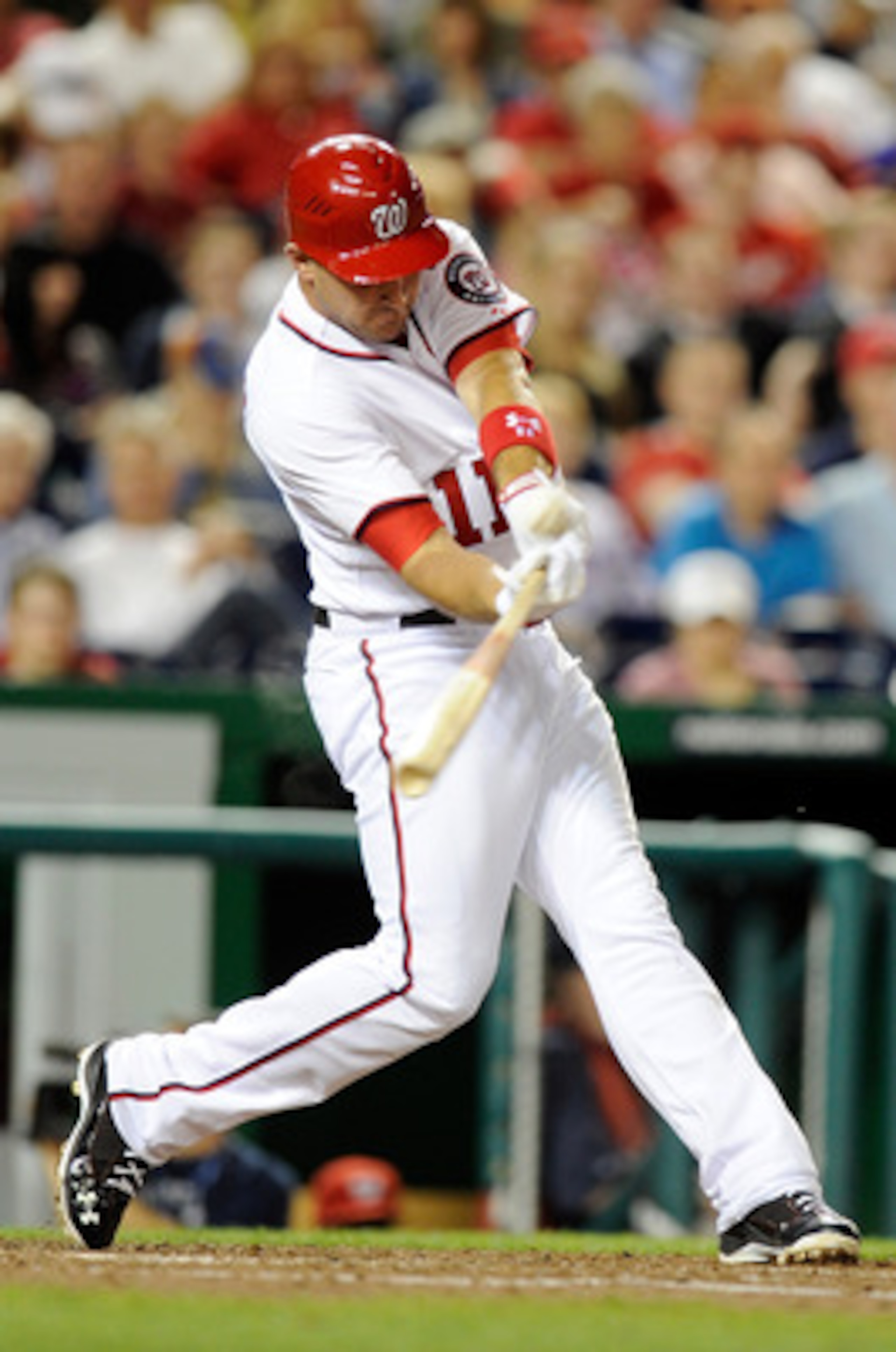 WASHINGTON, DC - JUNE 14:  Ryan Zimmerman #11 of the Washington Nationals hits a double in the seventh inning against the St. Louis Cardinals at Nationals Park on June 14, 2011 in Washington, DC. The Nationals won the game 8-6. (Photo by Greg Fiume/Getty