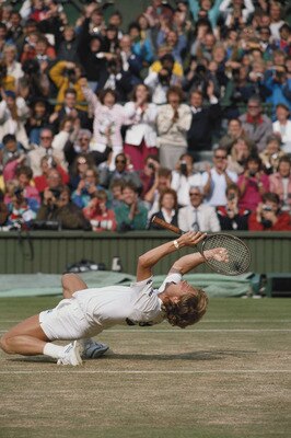 Stefan Edberg of Sweden falls to his knees in triumph to become champion after defeating Boris Becker during their Men's Singles final match at the Wimbledon Lawn Tennis Championship on 4th July 1988 at the All England Lawn Tennis and Croquet Club in Wimb