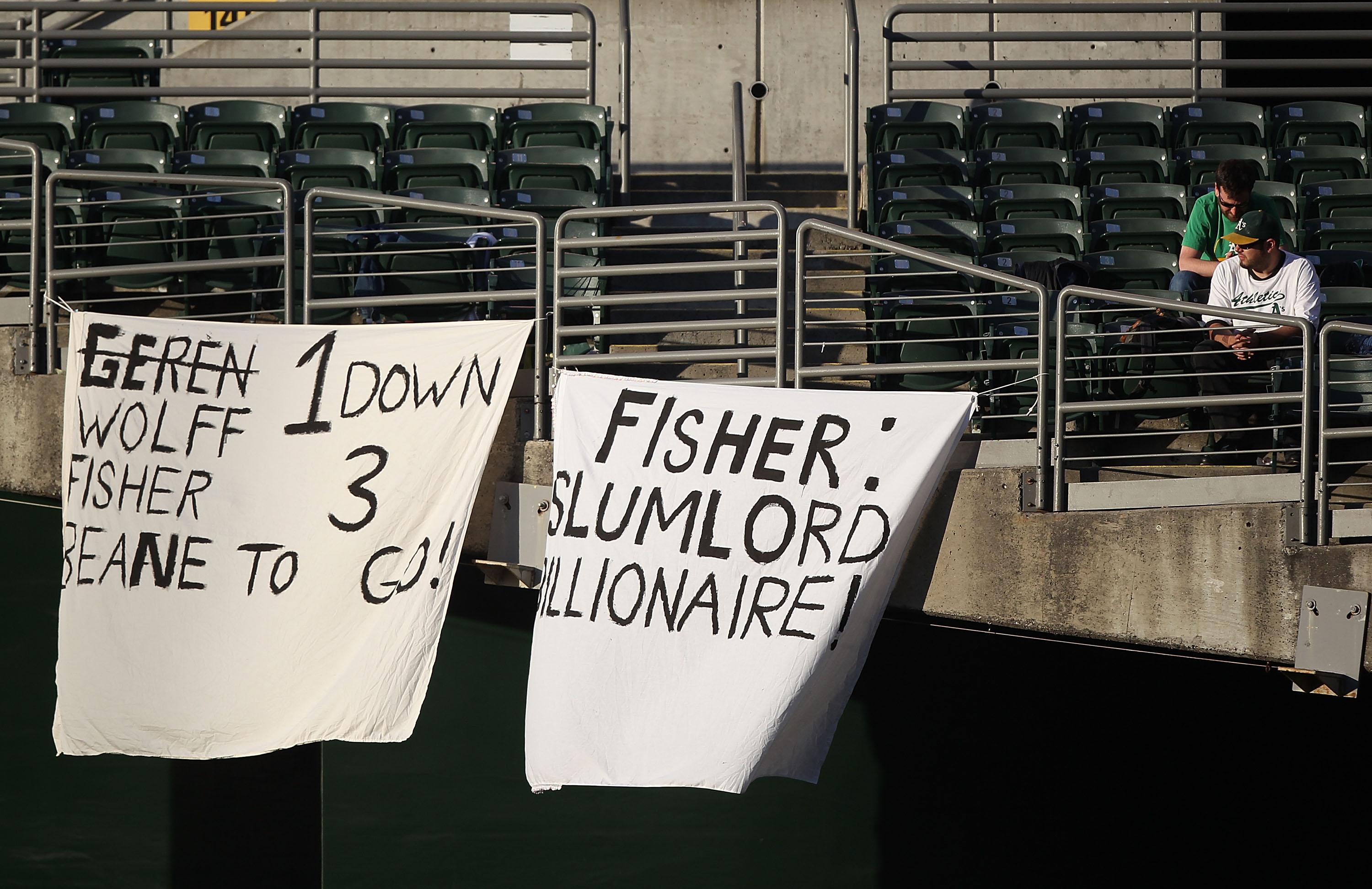 OAKLAND, CA - JUNE 15:  Fans hold signs during the Oakland Athletics and the Kansas City Royals game at the Oakland-Alameda County Coliseum on June 15, 2011 in Oakland, California.  (Photo by Jed Jacobsohn/Getty Images)