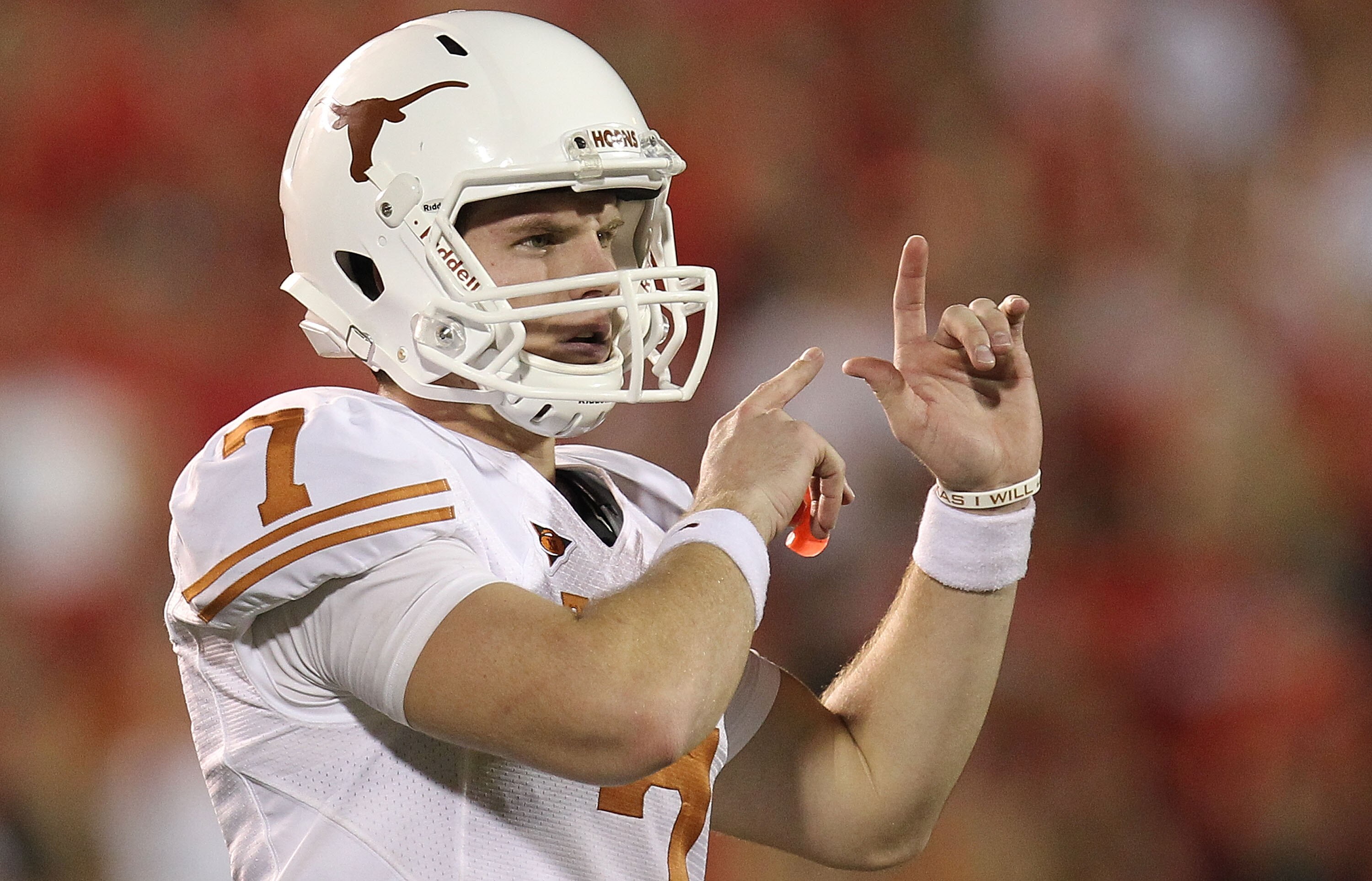 LUBBOCK, TX - SEPTEMBER 18:  Quarterback Garrett Gilbert #7 of the Texas Longhorns at Jones AT&T Stadium on September 18, 2010 in Lubbock, Texas.  (Photo by Ronald Martinez/Getty Images)