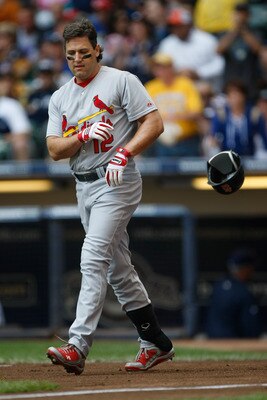 MILWAUKEE, WI - JUNE 12: Lance Berkman #12 of the St. Louis Cardinals throws his batting helmet after a strike out against the Milwaukee Brewers at Miller Park on June 12, 2011 in Milwaukee, Wisconsin. (Photo by Scott Boehm/Getty Images)