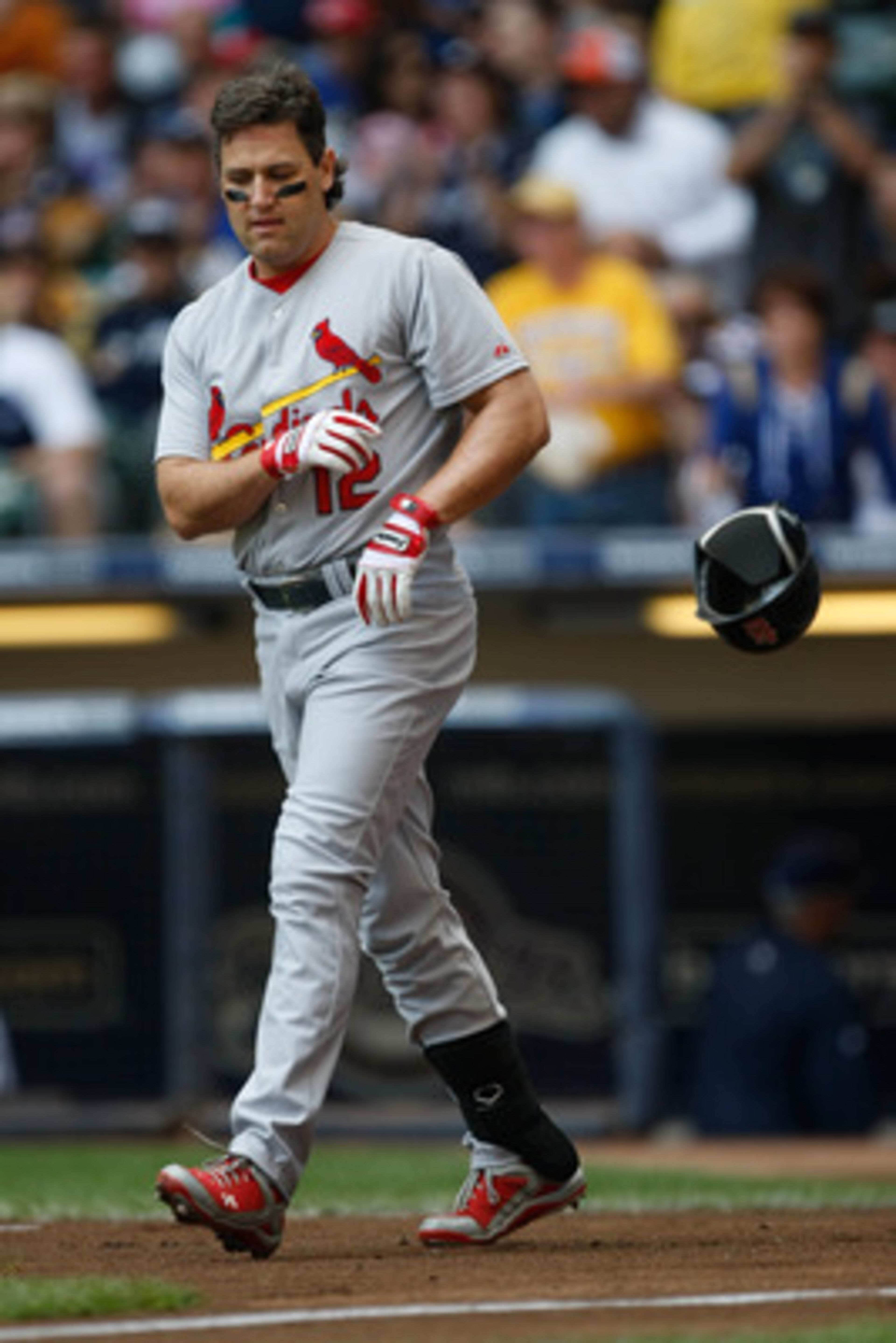 MILWAUKEE, WI - JUNE 12: Lance Berkman #12 of the St. Louis Cardinals throws his batting helmet after a strike out against the Milwaukee Brewers at Miller Park on June 12, 2011 in Milwaukee, Wisconsin. (Photo by Scott Boehm/Getty Images)