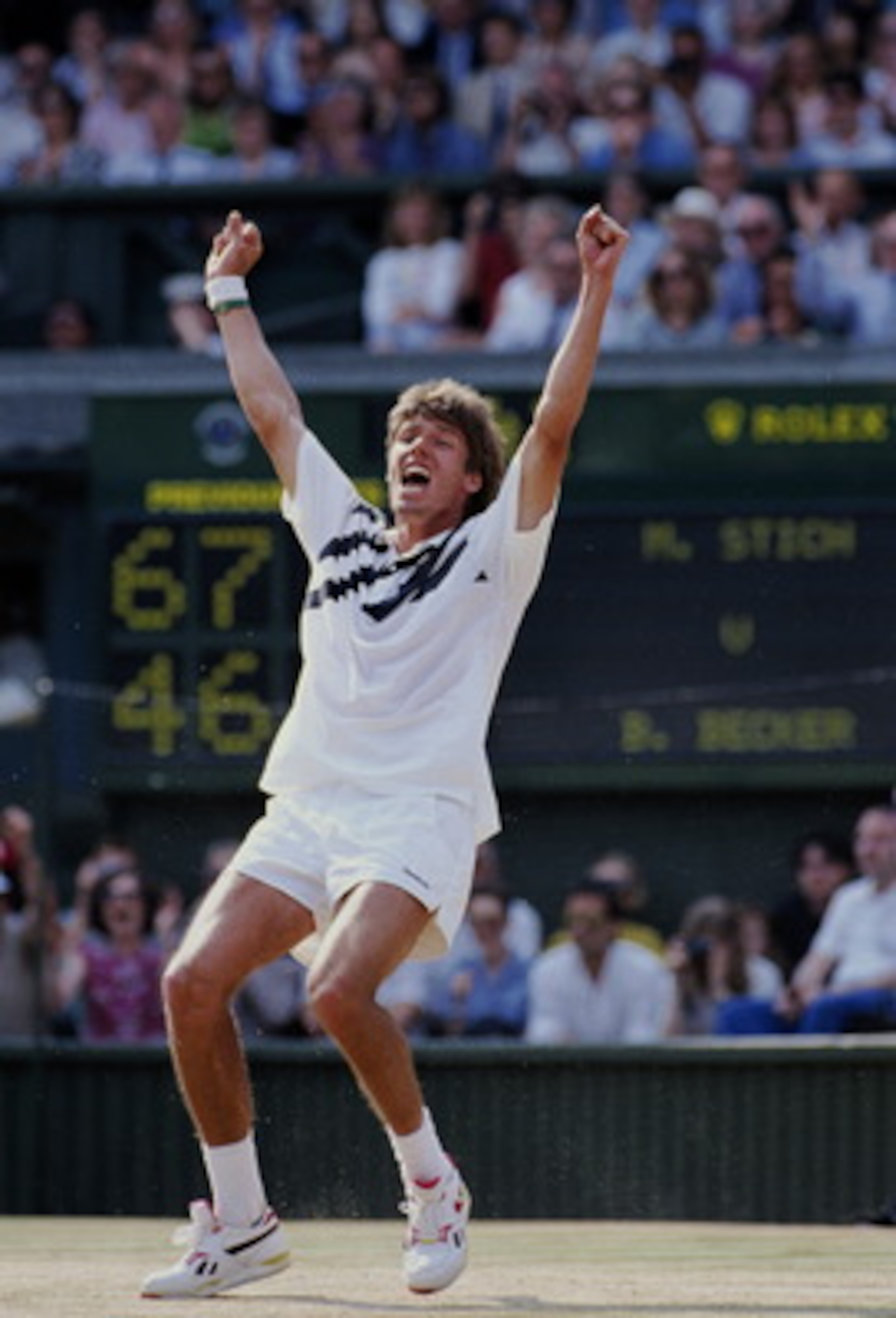 Michael Stich of Germany falls to his knees and raises his arms in triumph to become champion after defeating Boris Becker during their Men's Singles final match at the Wimbledon Lawn Tennis Championship on 7th July 1991 at the All England Lawn Tennis and Michael Stich of Germany falls to his knees and raises his arms in triumph to become champion after defeating Boris Becker during their Men's Singles final match at the Wimbledon Lawn Tennis Championship on 7th July 1991 at the All England Lawn Tennis and