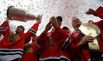 CHICAGO - JUNE 11: (L-R) Dave Bolland #36, Jonathan Toews #19, and Patrick Kane #88 celebrate with the crowd during the Chicago Blackhawks Stanley Cup victory parade and rally on June 11, 2010 in Chicago, Illinois. (Photo by Jonathan Daniel/Getty Images)