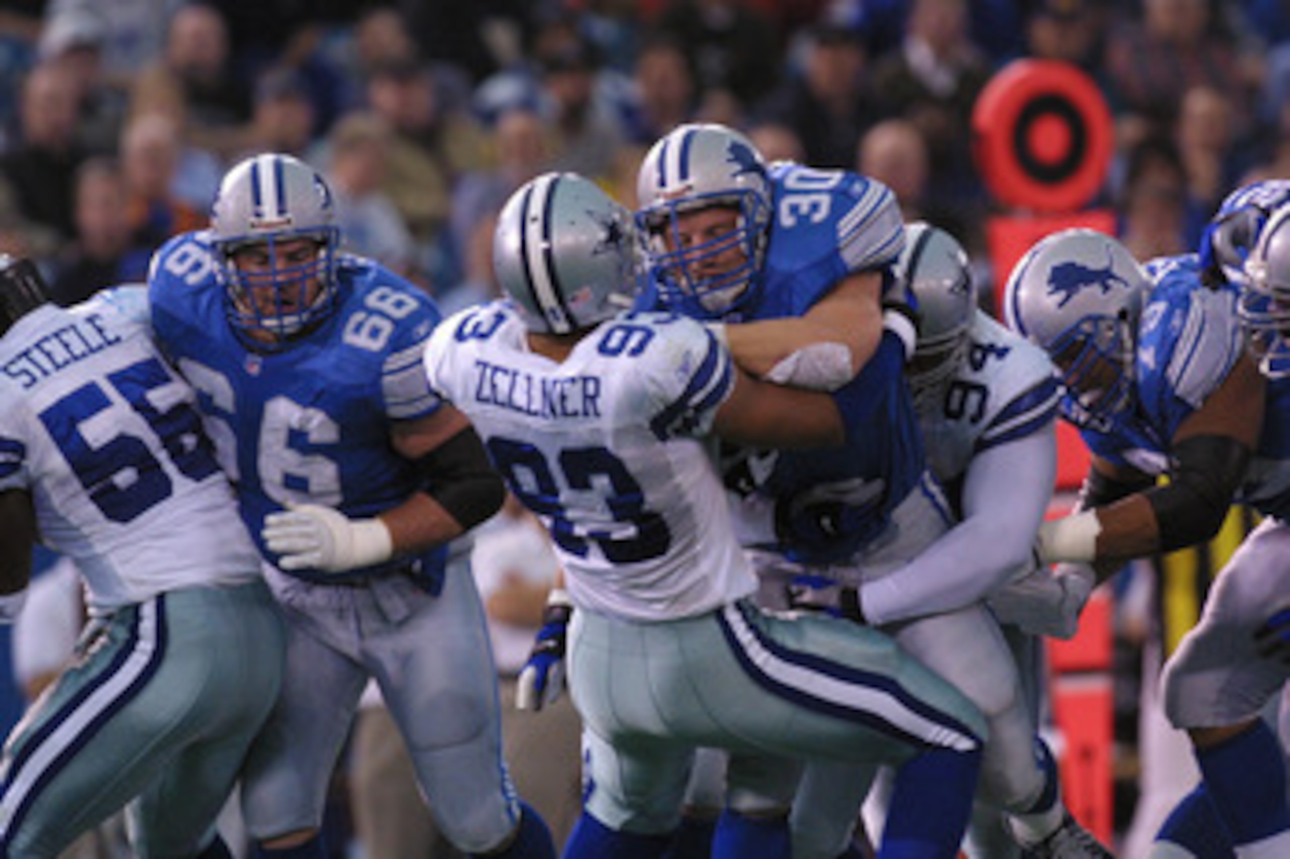 6 Jan 2002:  Cory Schlesinger #30 of the Detroit Lions battles Peppi Zellner #93 of the Dallas Cowboys during the game at Pontiac Silverdome in Pontiac, Michigan. The Lions won 15-10. DIGITAL IMAGE. Mandatory Credit: Danny Moloshok/Getty Images