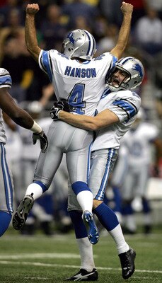 SAN ANTONIO - DECEMBER 24:  Kicker Jason Hanson #4 of the Detroit Lions celebrates a 39-yard game winning field goal with Nick Harris #2 against the New Orleans Saints on December 24, 2005 at the Alamodome in San Antonio, Texas. The Lions defeated the Sai