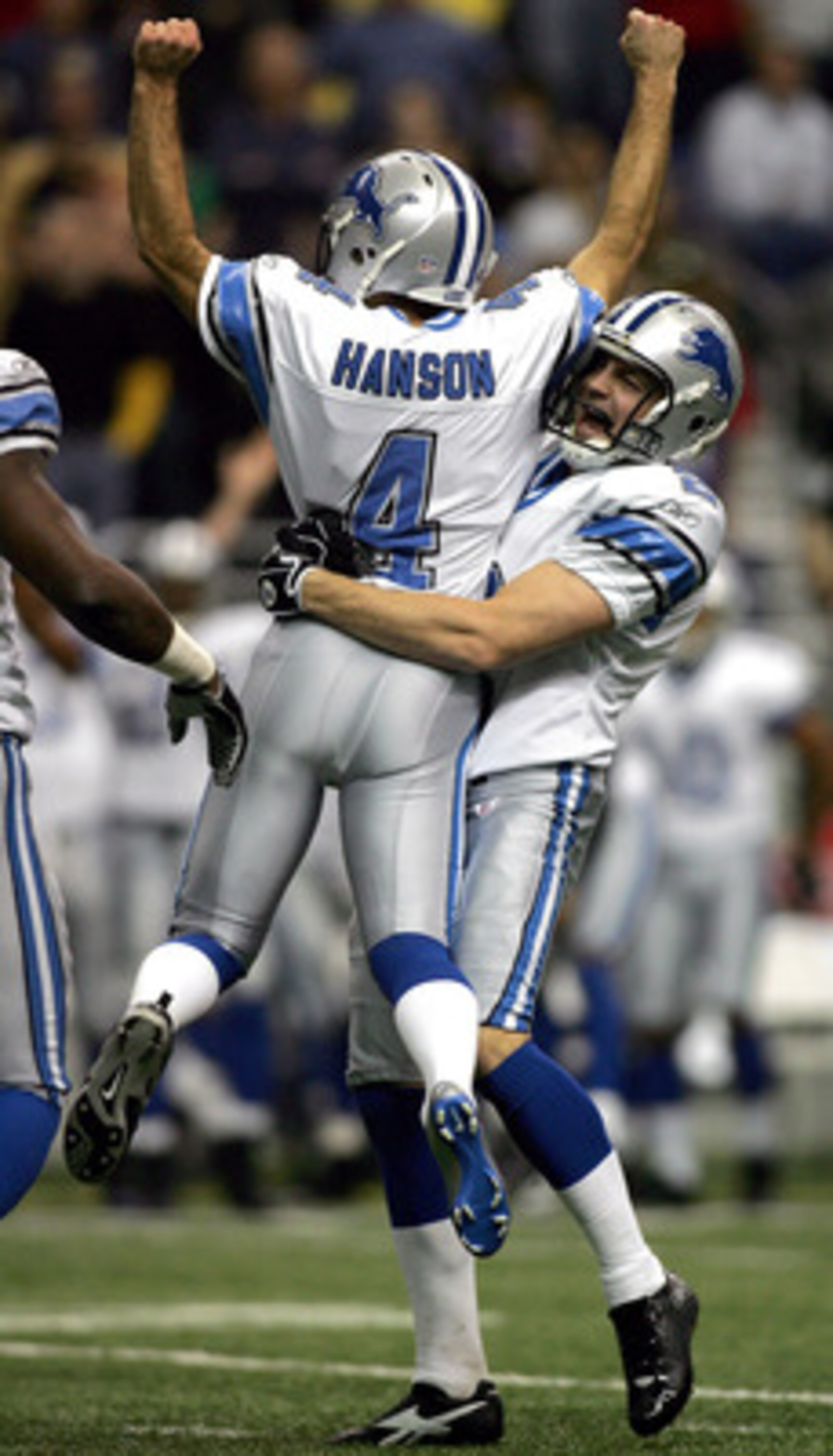 SAN ANTONIO - DECEMBER 24:  Kicker Jason Hanson #4 of the Detroit Lions celebrates a 39-yard game winning field goal with Nick Harris #2 against the New Orleans Saints on December 24, 2005 at the Alamodome in San Antonio, Texas. The Lions defeated the Sai