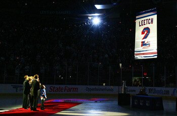 NEW YORK - JANUARY 24:  Former New York Ranger Brian Leetch stands with his family and friends as his banner is raised to the rafters before the game against the Atlanta Thrashers on January 24, 2008 at Madison Square Garden in New York City.Leetch became