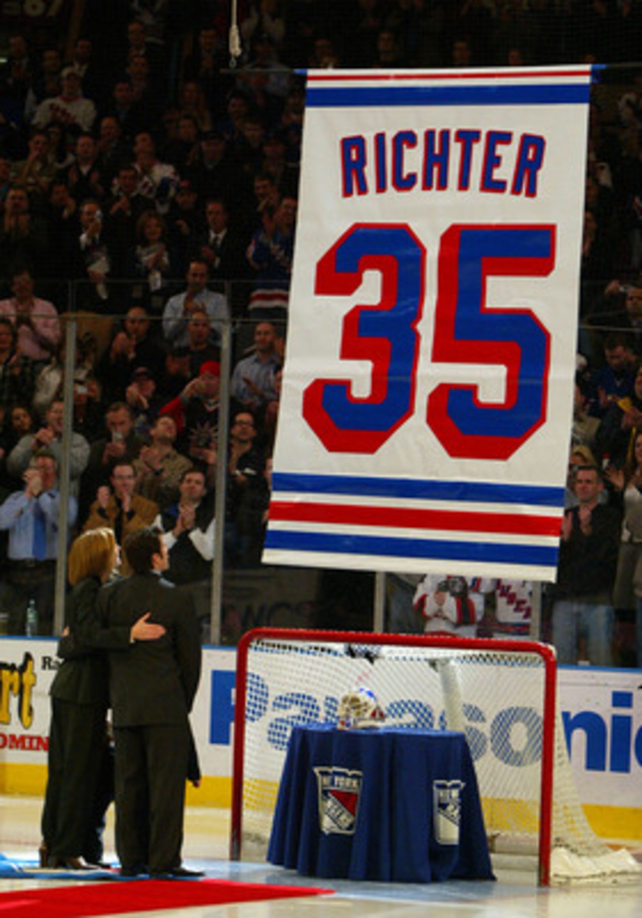 NEW YORK - FEBRUARY 4:  Former goalie of the New York Rangers Mike Richter and his wife Veronica watch his #35 jersey banner rises to the rafters as his jersey is retired at Madison Square Garden prior to the Rangers' game against the Minnesota Wild on Fe