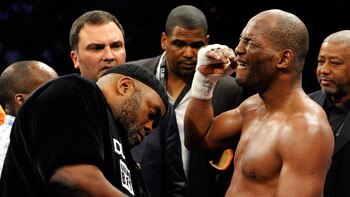 LAS VEGAS - APRIL 03:  Bernard Hopkins (R) reacts as his trainer Naazim Richardson takes his gloves off after Hopkins defeated Roy Jones Jr. in their light heavyweight bout by unanimous decision at the Mandalay Bay Events Center April 3, 2010 in Las Vegas