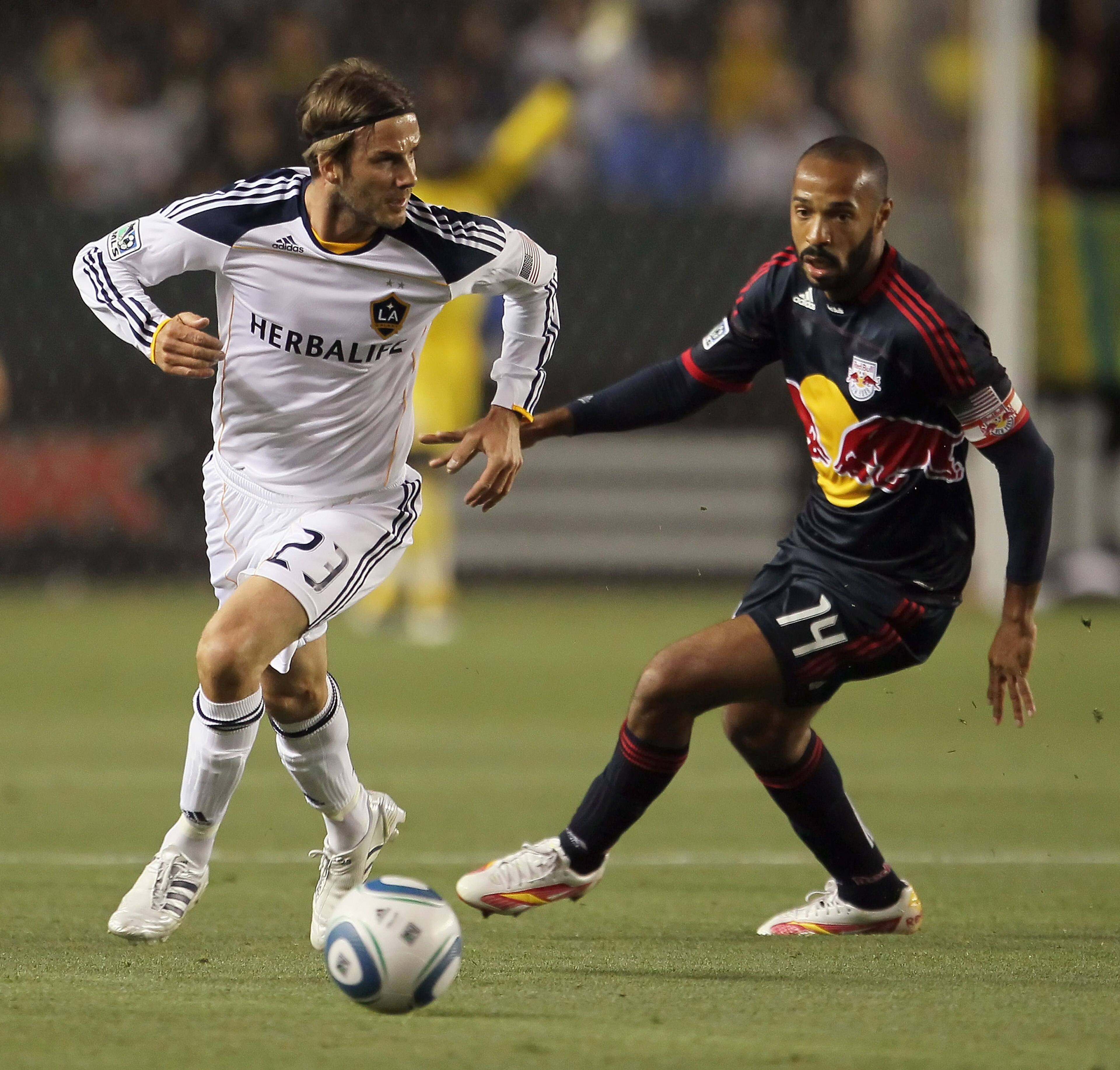 CARSON, CA - MAY 07:  David Beckham #23 of the Los Angeles Galaxy is pursued by Thierry Henry #14 of the New York Red Bulls in the first half at The Home Depot Center on May 7, 2011 in Carson, California. The Red Bulls and Galaxy played to a 1-1 draw.  (P