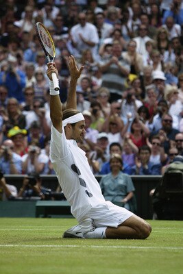 LONDON - JULY 6:  Roger Federer of Switzerland celebrates after his victory over Mark Philippoussis of Australia in the Men's Singles Final during the final day of the Wimbledon Lawn Tennis Championships held on July 6, 2003 at the All England Lawn Tennis