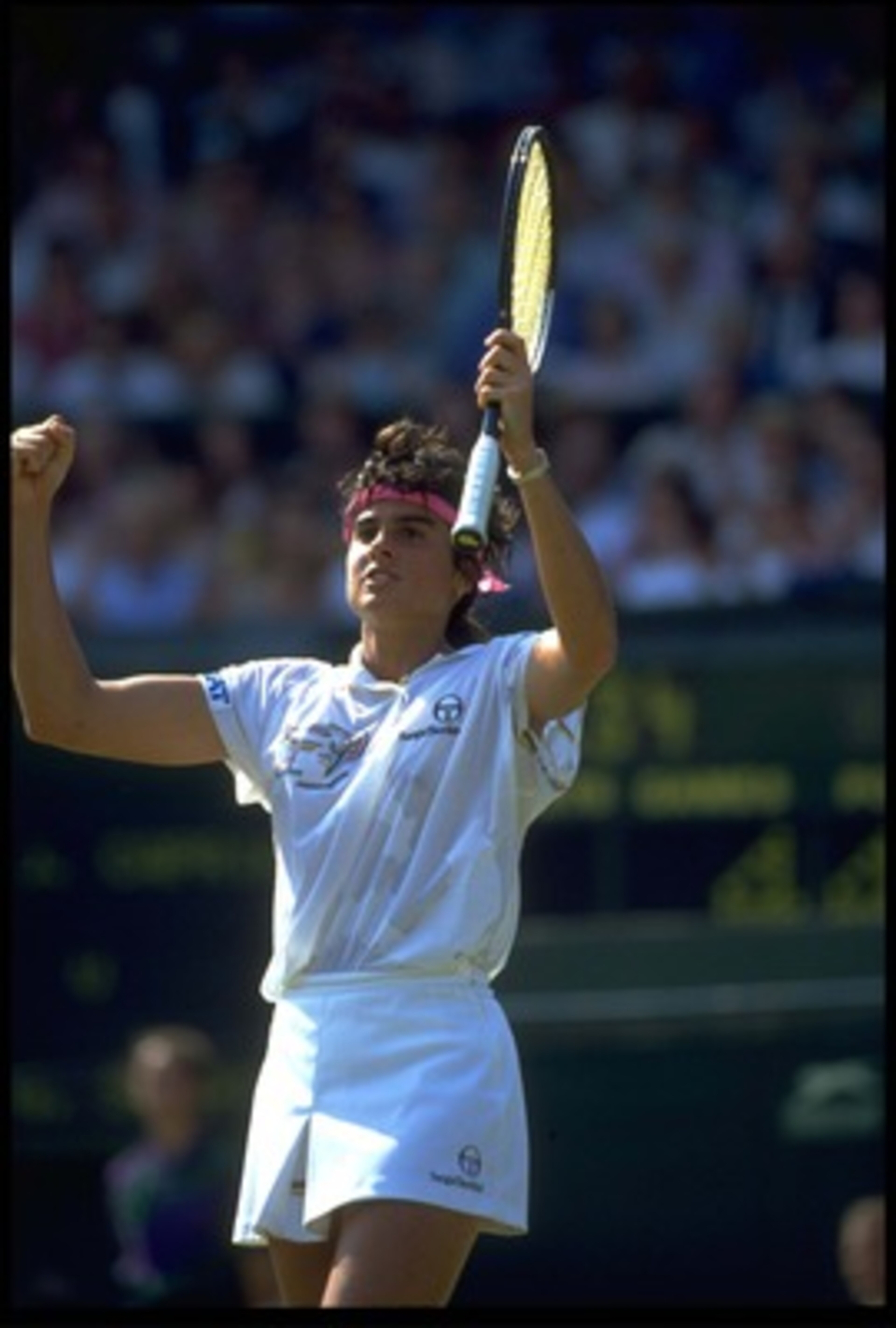 4 JUL 1991: GABRIELA SABATINI OF ARGENTINA CELEBRATES DURING HER SEMI-FINAL MATCH AGAINST JENNIFER CAPRIATI AT THE 1991 WIMBLEDON CHAMPIONSHIPS. 4 JUL 1991: GABRIELA SABATINI OF ARGENTINA CELEBRATES DURING HER SEMI-FINAL MATCH AGAINST JENNIFER CAPRIATI AT THE 1991 WIMBLEDON CHAMPIONSHIPS.