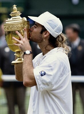 Andre Agassi of the United States kisses the trophy after his  6Â7 (8Â10), 6Â4, 6Â4, 1Â6, 6Â4 victory over Goran Ivanisevicin the Men's Singles Final at the Wimbledon Lawn Tennis Championships on 5th July 1992 at the All England Lawn Tennis and Croquet Cl