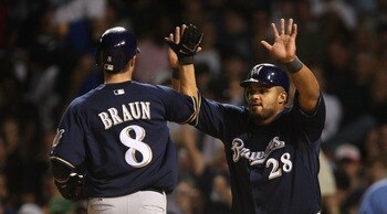 CHICAGO - AUGUST 29: Prince Fielder #28 of the Milwaukee Brewers greets teammate Ryan Braun #8 after Braun scored a run in the 7th inning against the Chicago Cubs on August 29, 2007 at Wrigley Field in Chicago, Illinois. (Photo by Jonathan Daniel/Getty Im