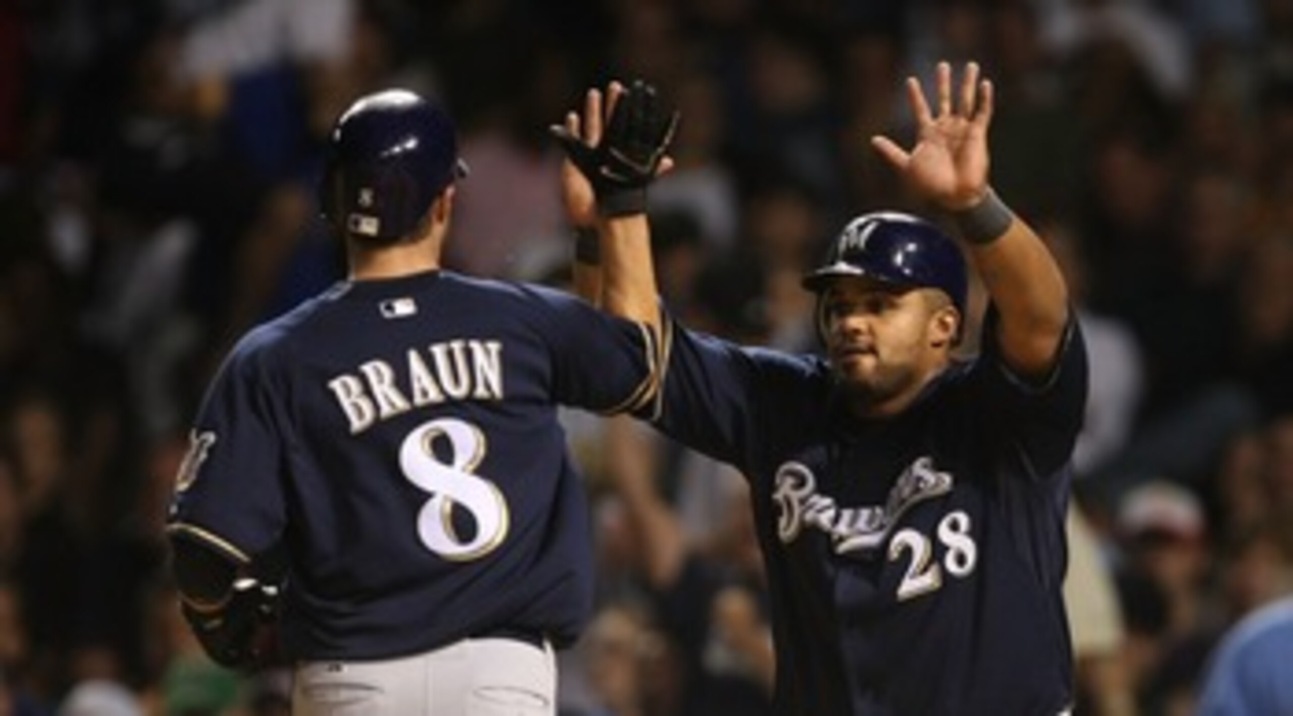 CHICAGO - AUGUST 29: Prince Fielder #28 of the Milwaukee Brewers greets teammate Ryan Braun #8 after Braun scored a run in the 7th inning against the Chicago Cubs on August 29, 2007 at Wrigley Field in Chicago, Illinois. (Photo by Jonathan Daniel/Getty Im