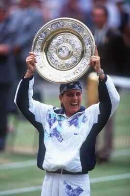 2 JUL 1994:  CONCHITA MARTINEZ OF SPAIN HOLDS THE TROPHY AS SHE CELEBRATES HER WIN OVER MARTINA NAVRATILOVA IN THE 1994 WIMBLEDON LADIES FINAL.  MARTINEZ WON 6-4, 3-6, 6-3. Mandatory Credit: Bob Martin/ALLSPORT