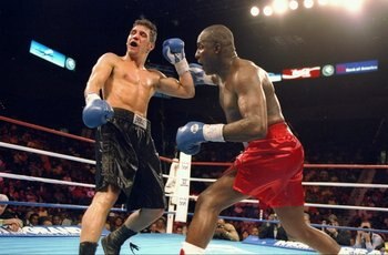 4 Mar 1994:  Randall Yonker (left) trades punches with his opponent Mike McCallum during their fight in Las Vegas, Nevada.  McCallum won the bout with a TKO in the fifth round. Mandatory Credit: Al Bello  /Allsport