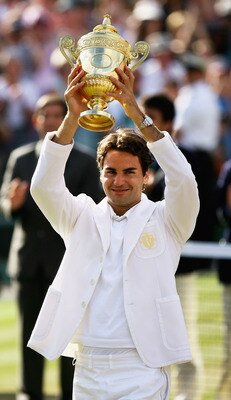 LONDON - JULY 08:  Roger Federer of Switzerland lifts the trophy as he celebrates victory following the Men's Singles final match against Rafael Nadal of Spain during day thirteen of the Wimbledon Lawn Tennis Championships at the All England Lawn Tennis a