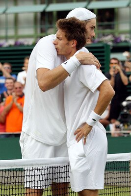 LONDON, ENGLAND - JUNE 24:  Nicolas Mahut of France (R) after losing on the third day of his first round match against John Isner of USA on Day Four of the Wimbledon Lawn Tennis Championships at the All England Lawn Tennis and Croquet Club on June 24, 201