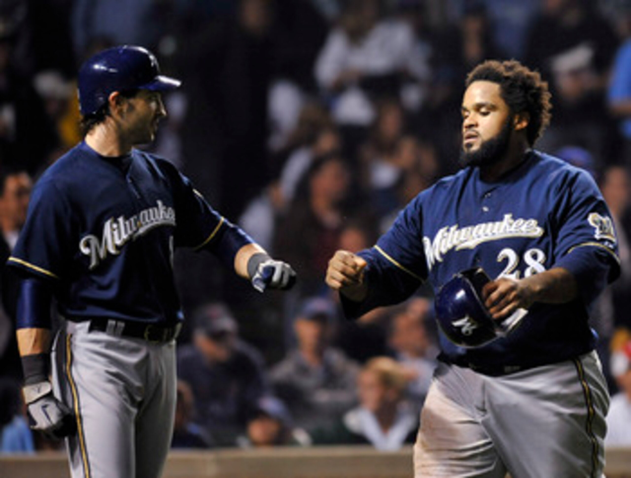 CHICAGO, IL - JUNE 15:  Ryan Braun # 8 of the Milwaukee Brewers and Prince Fielder #28 celebrate after scoring against the Chicago Cubs on June 15, 2011 at Wrigley Field in Chicago, Illinois.  (Photo by David Banks/Getty Images)