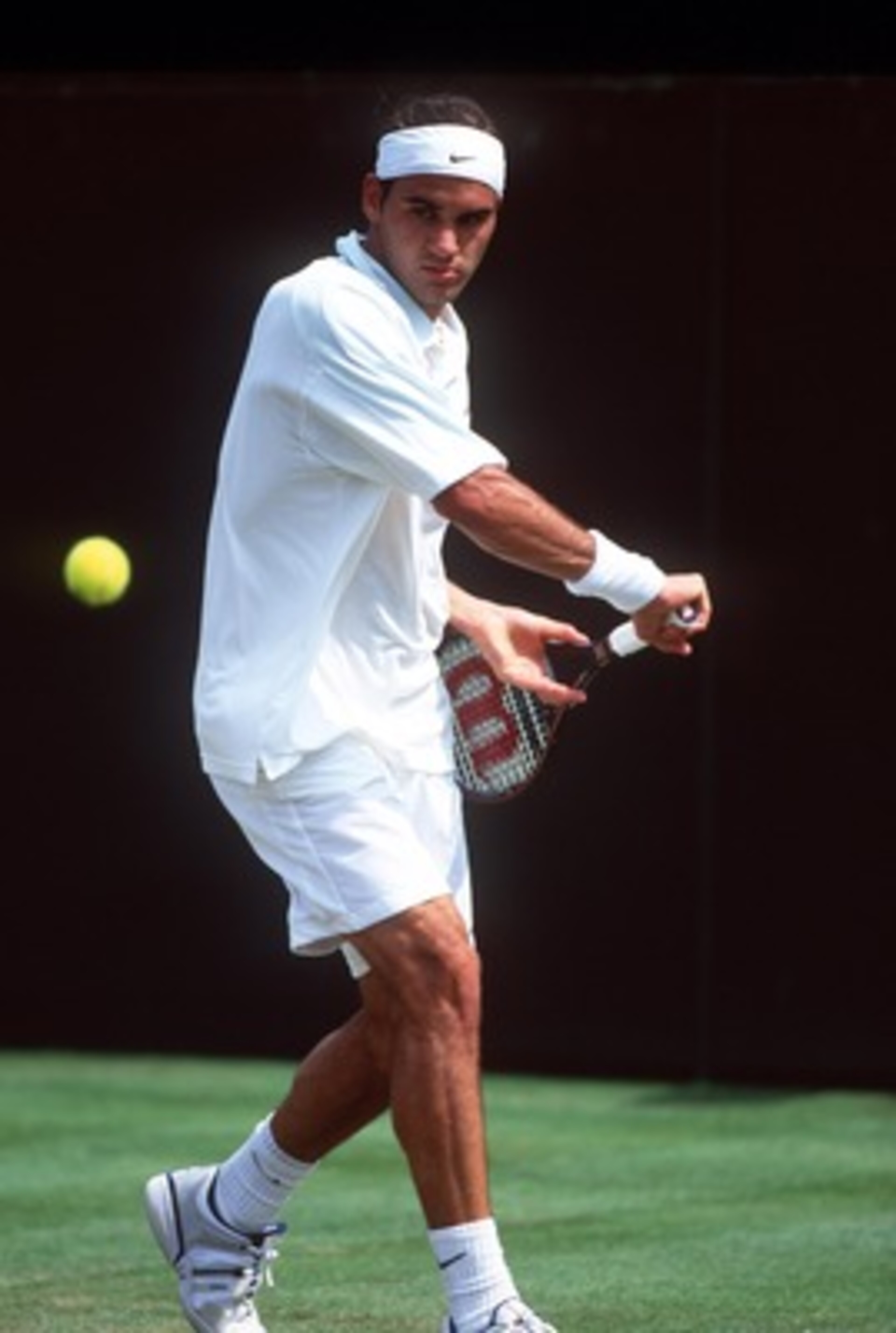 27 Jun 2001: Roger Federer of Switzerland in action against Xavier Malisse of Belgium during the men's second round of The All England Lawn Tennis Championship at Wimbledon, London.+DIGITAL IMAGE+ Mandatory Credit: Clive Brunskill/ALLSPORT 27 Jun 2001: Roger Federer of Switzerland in action against Xavier Malisse of Belgium during the men's second round of The All England Lawn Tennis Championship at Wimbledon, London.+DIGITAL IMAGE+ Mandatory Credit: Clive Brunskill/ALLSPORT